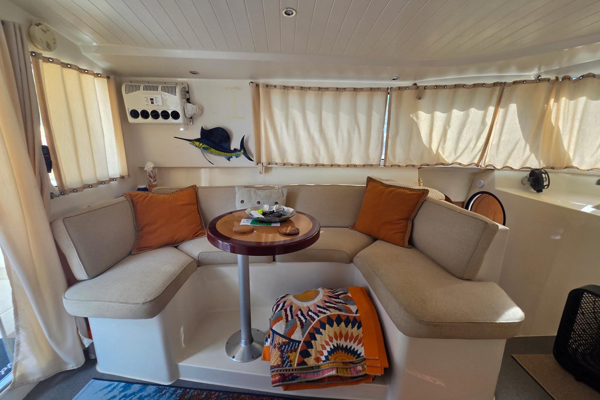 Interior of 2000 Fountaine Pajot Maryland 37 yacht with cozy seating and decor.