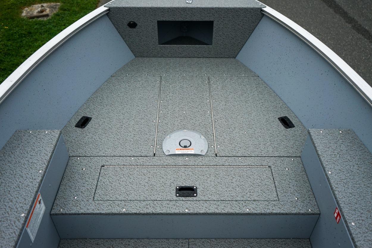 2026 Lund 1400 Fury Tiller boat interior with gray textured flooring.