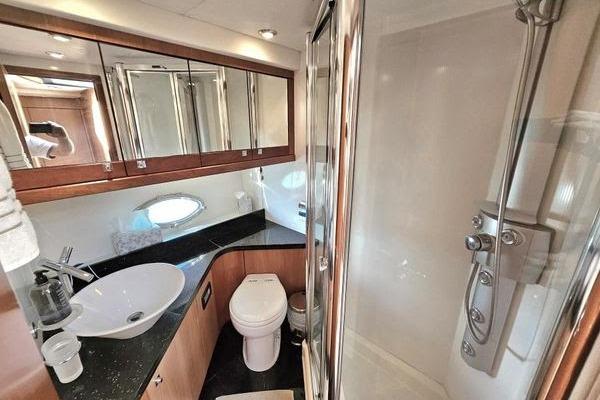 Luxurious bathroom in 2005 Sunseeker Manhattan 66 yacht with modern fixtures and shower.