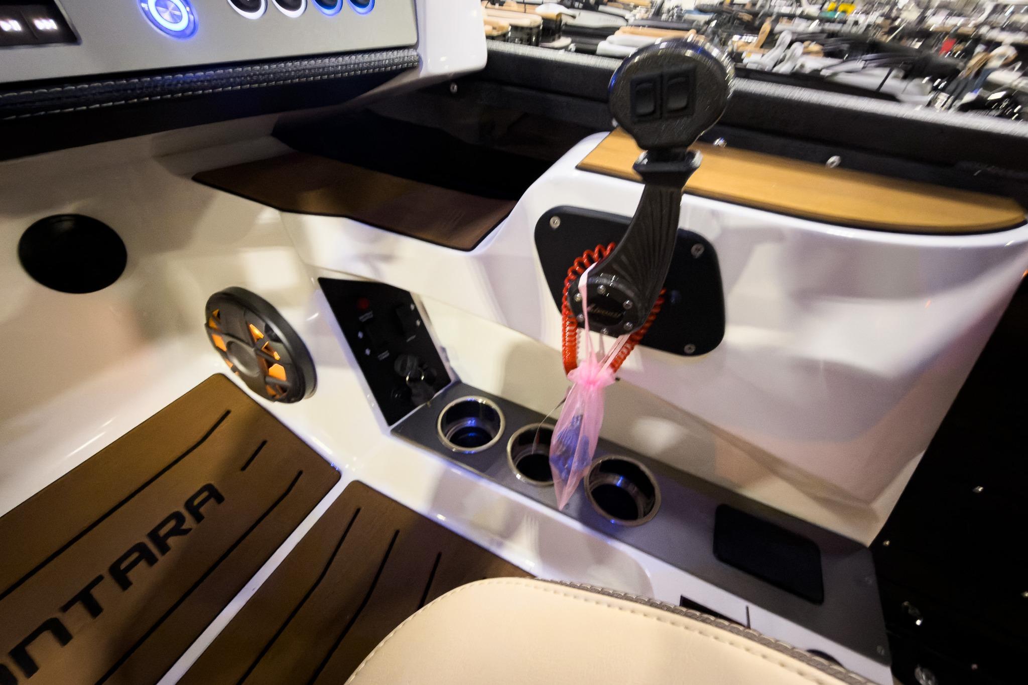 Interior of 2026 Montara Surf Boss EVO boat with controls and speaker.
