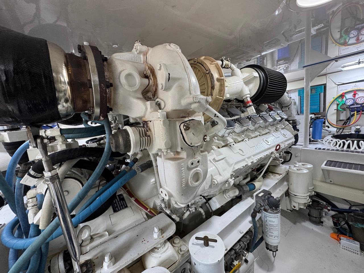 Engine room of a 2007 Viking 52 Convertibles yacht, showcasing detailed machinery and components.