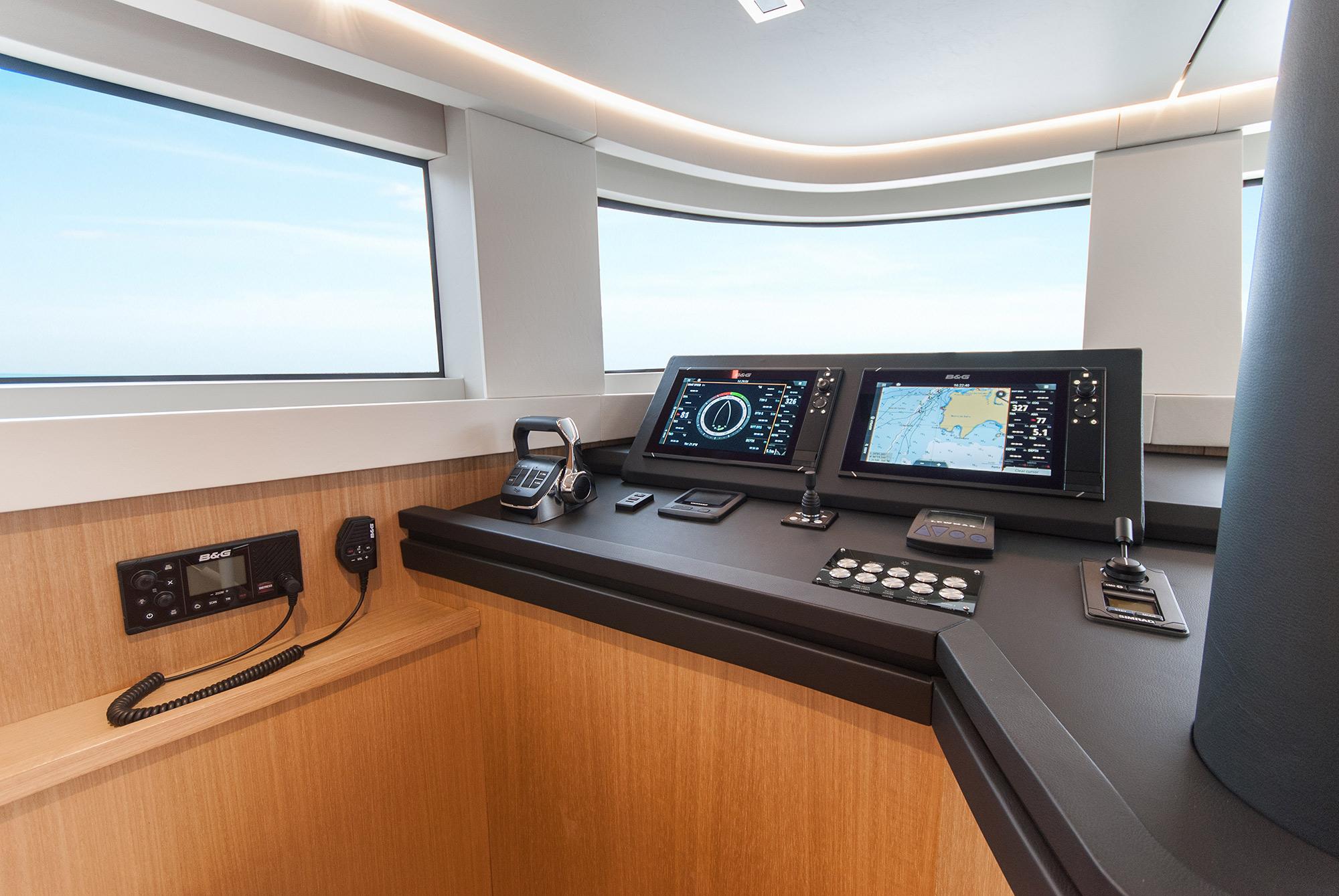 Modern helm station of 2027 MCP Global Exp 68 yacht with advanced navigation systems.