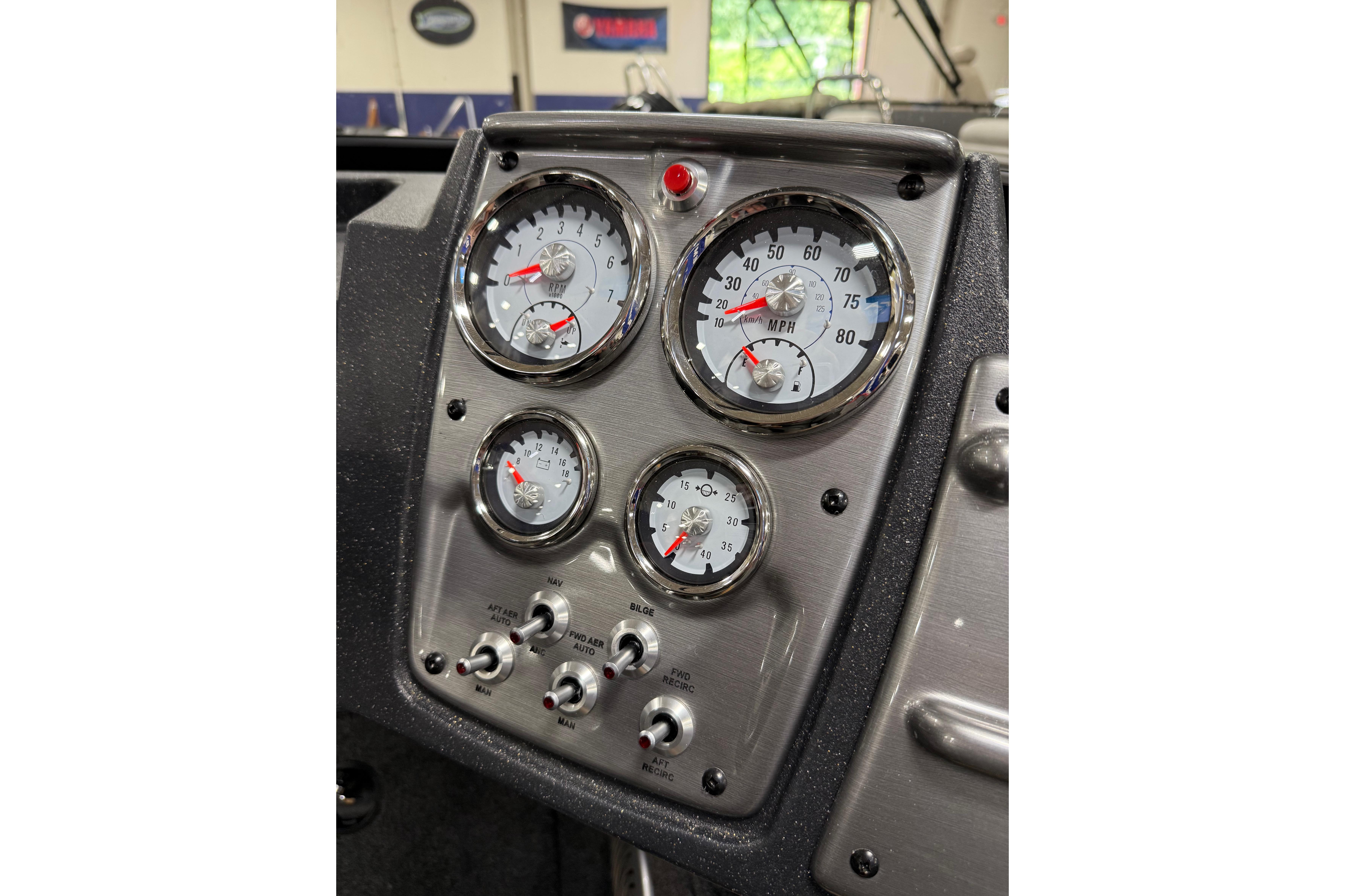Dashboard of 2026 Tracker Pro Guide V-175 Combo boat with gauges and switches.
