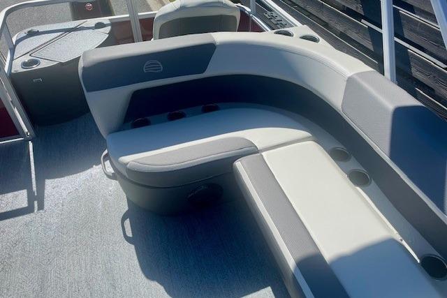 2026 Sun Tracker Bass Buggy 18 DLX pontoon boat interior with cushioned seating.