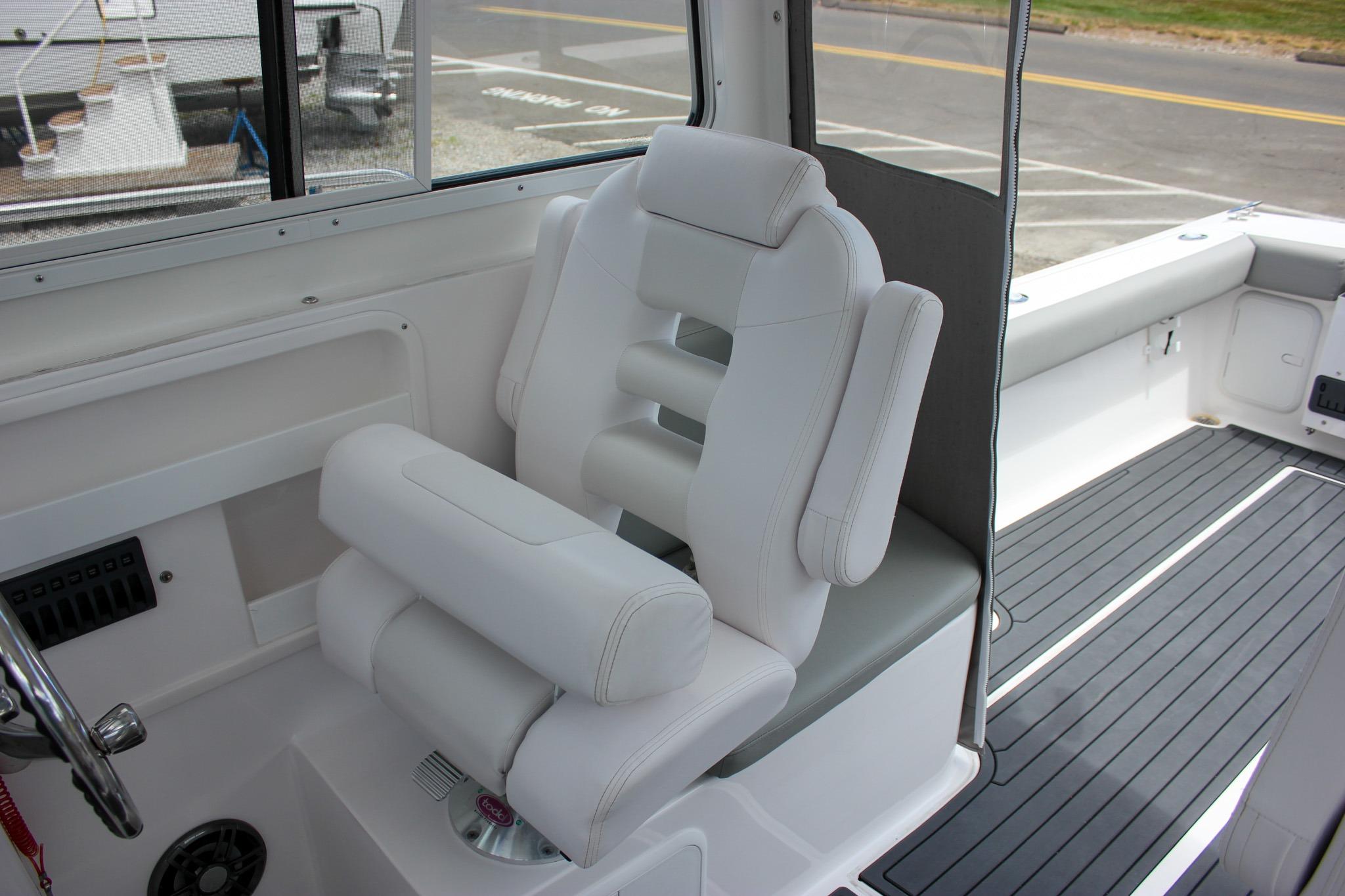2022 NorthCoast 235 Cabin interior with plush white seating and modern design.