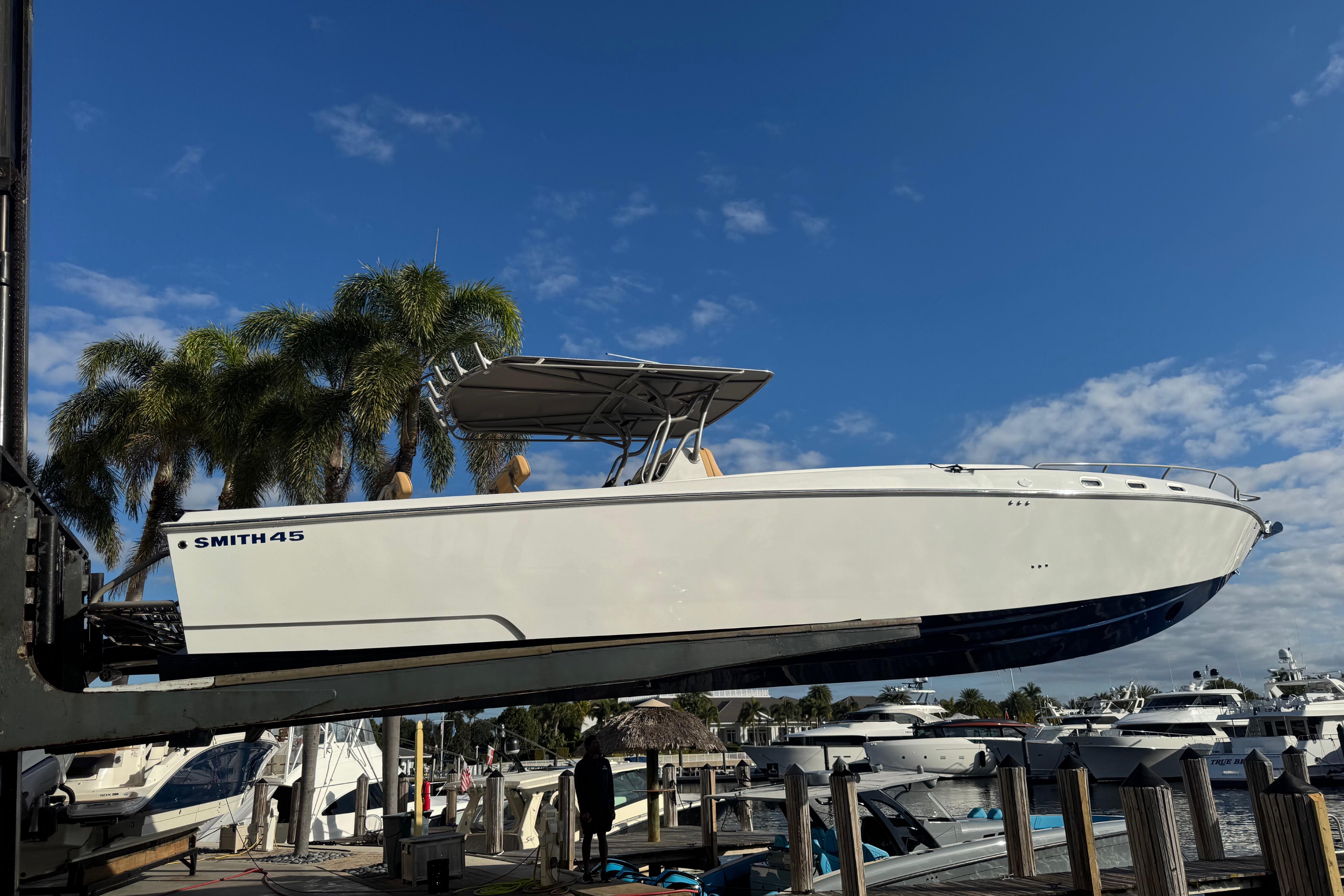 2008 Don Smith 45 boat lifted at marina, clear sky background.