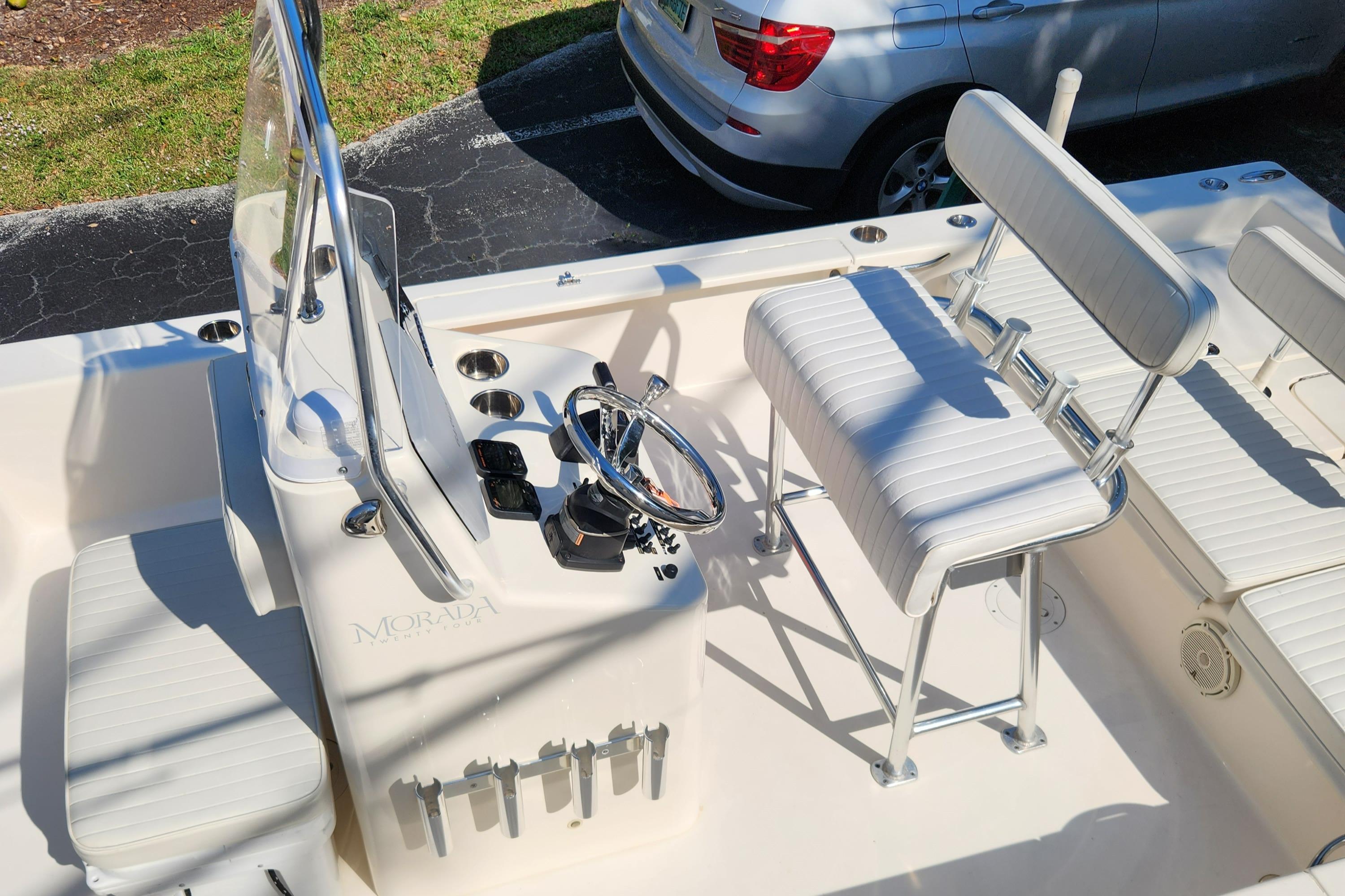 2014 Islamorada Boatworks Morada 24 interior with steering console and seating.