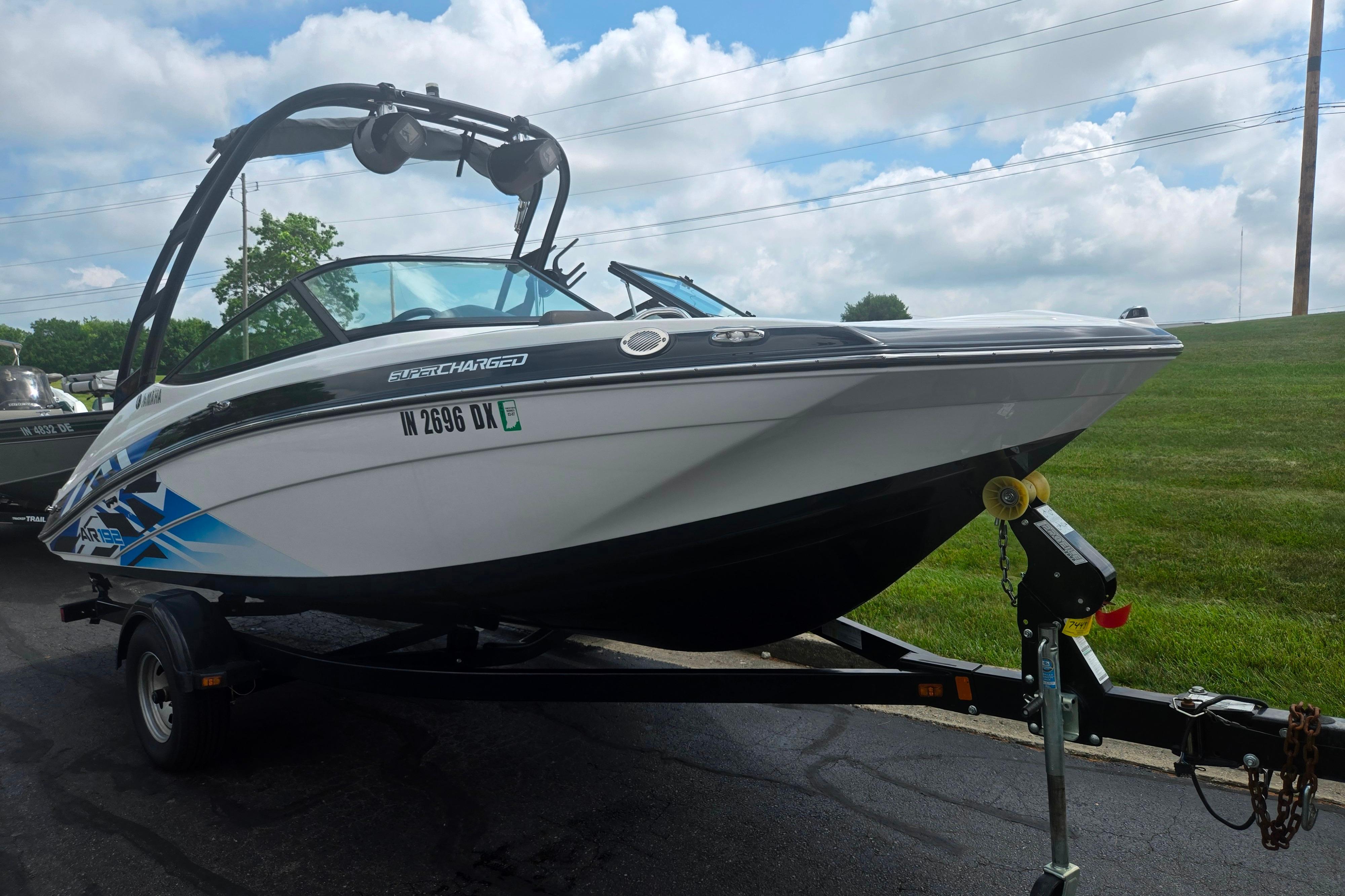 2016 Yamaha Boats AR192 on trailer, parked outdoors under cloudy sky.