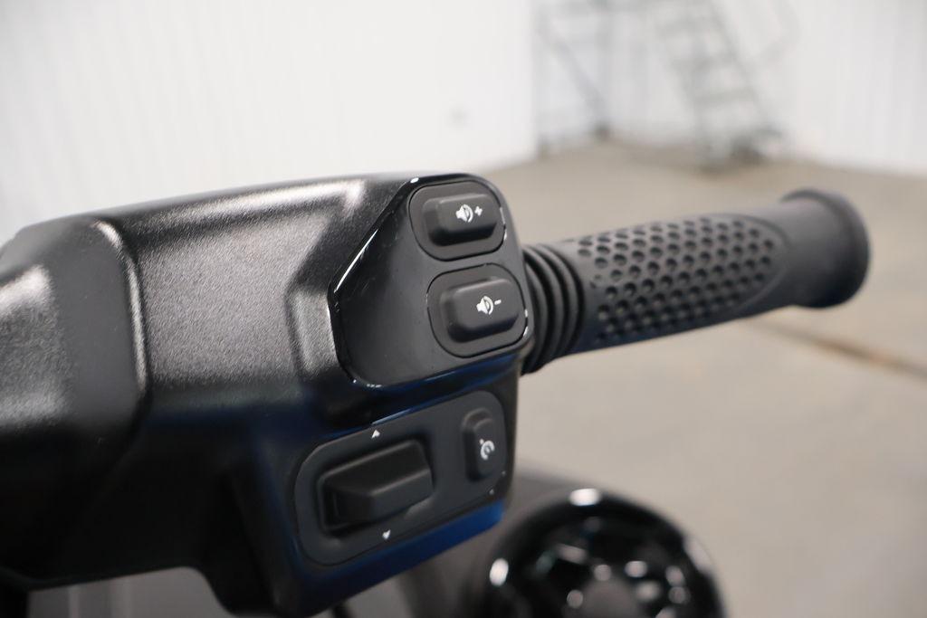 Handlebar controls of 2026 Sea-Doo RXT-X 325 watercraft, featuring ergonomic grip and buttons.