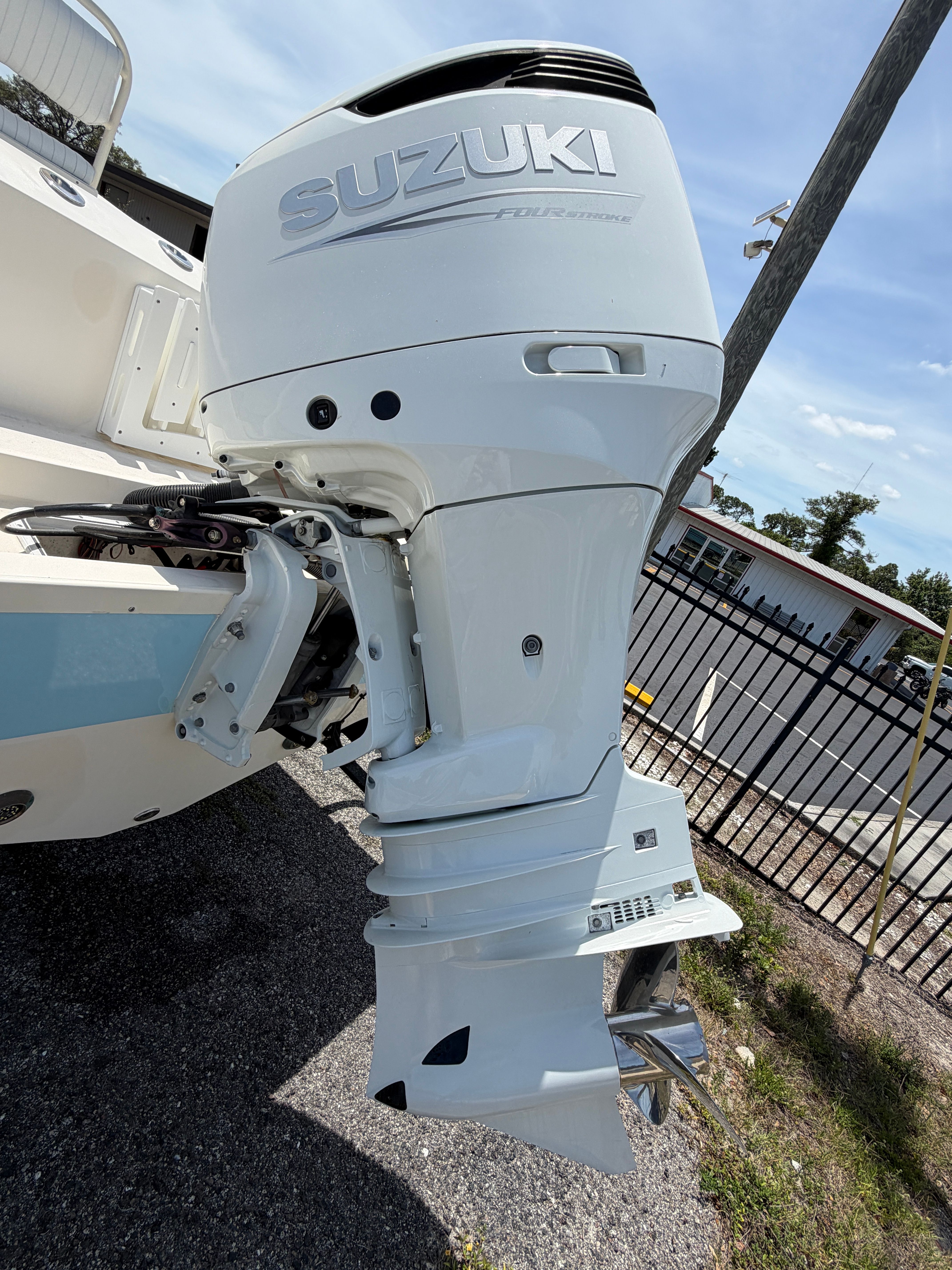 Suzuki outboard motor on McKee Craft 24 FREEDOM boat, year 2004.