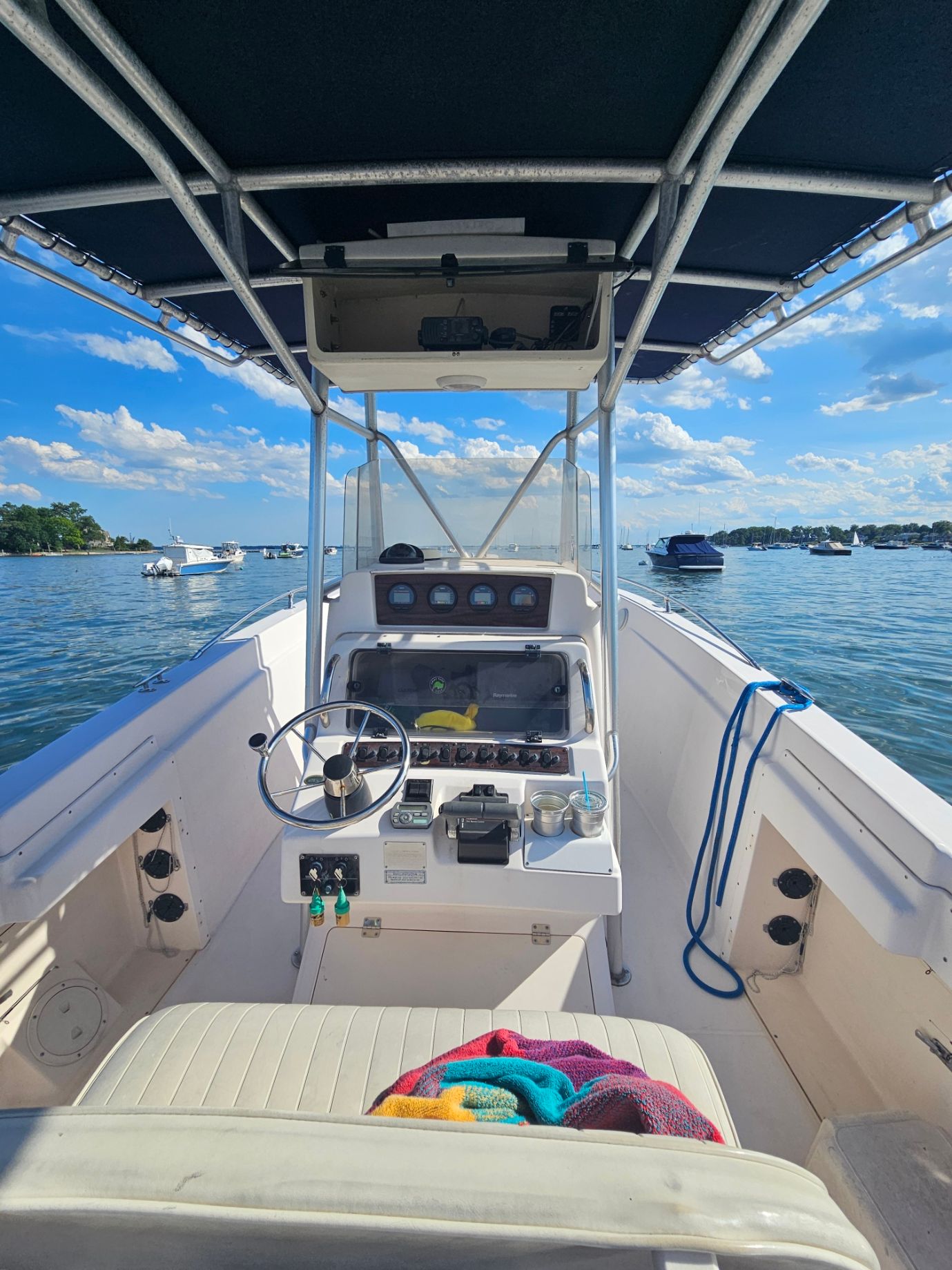 The image shows the cockpit of a Grady-White Chase 263 boat on calm water.