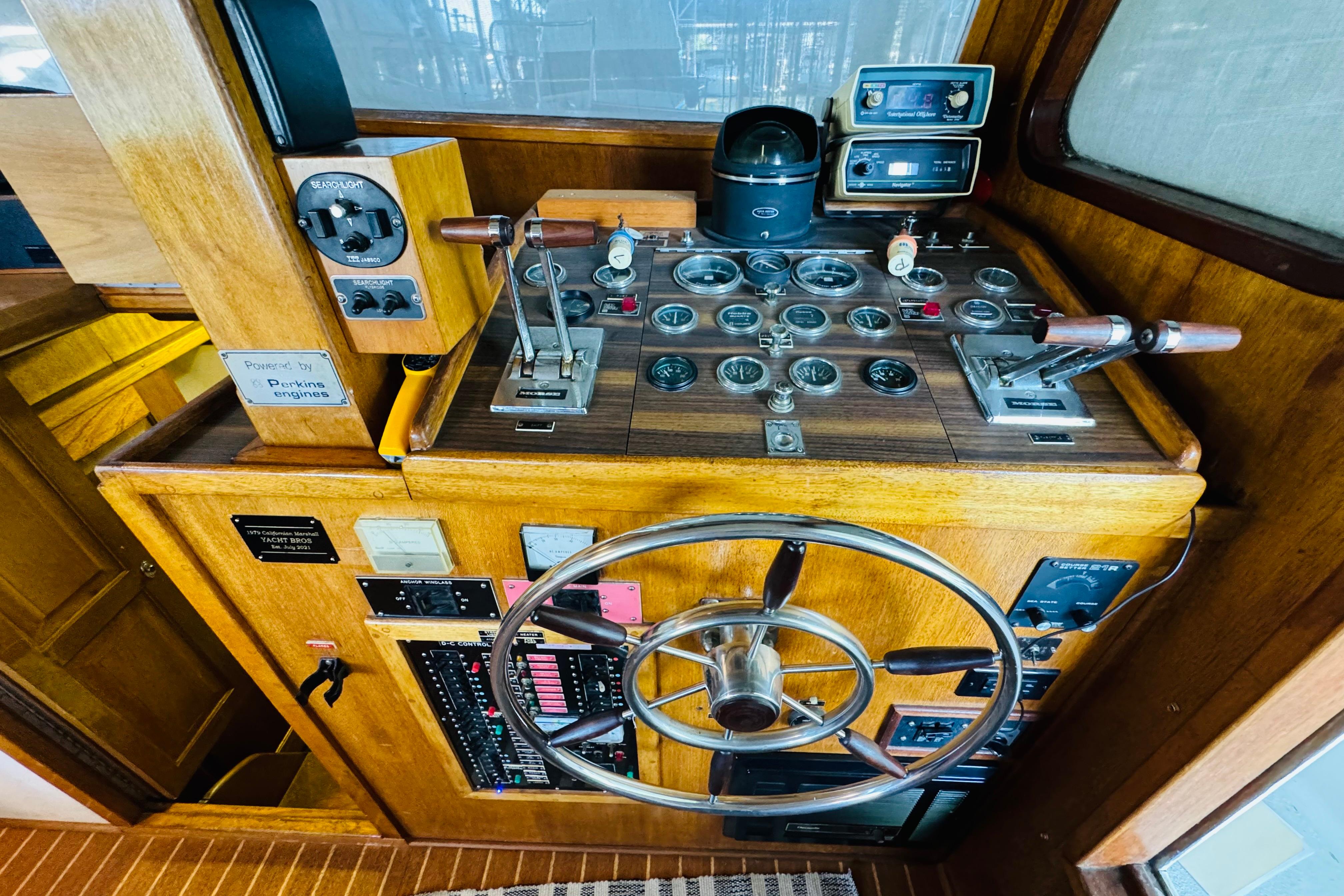 1978 Californian 42 LRC yacht helm with vintage controls and wooden dashboard.