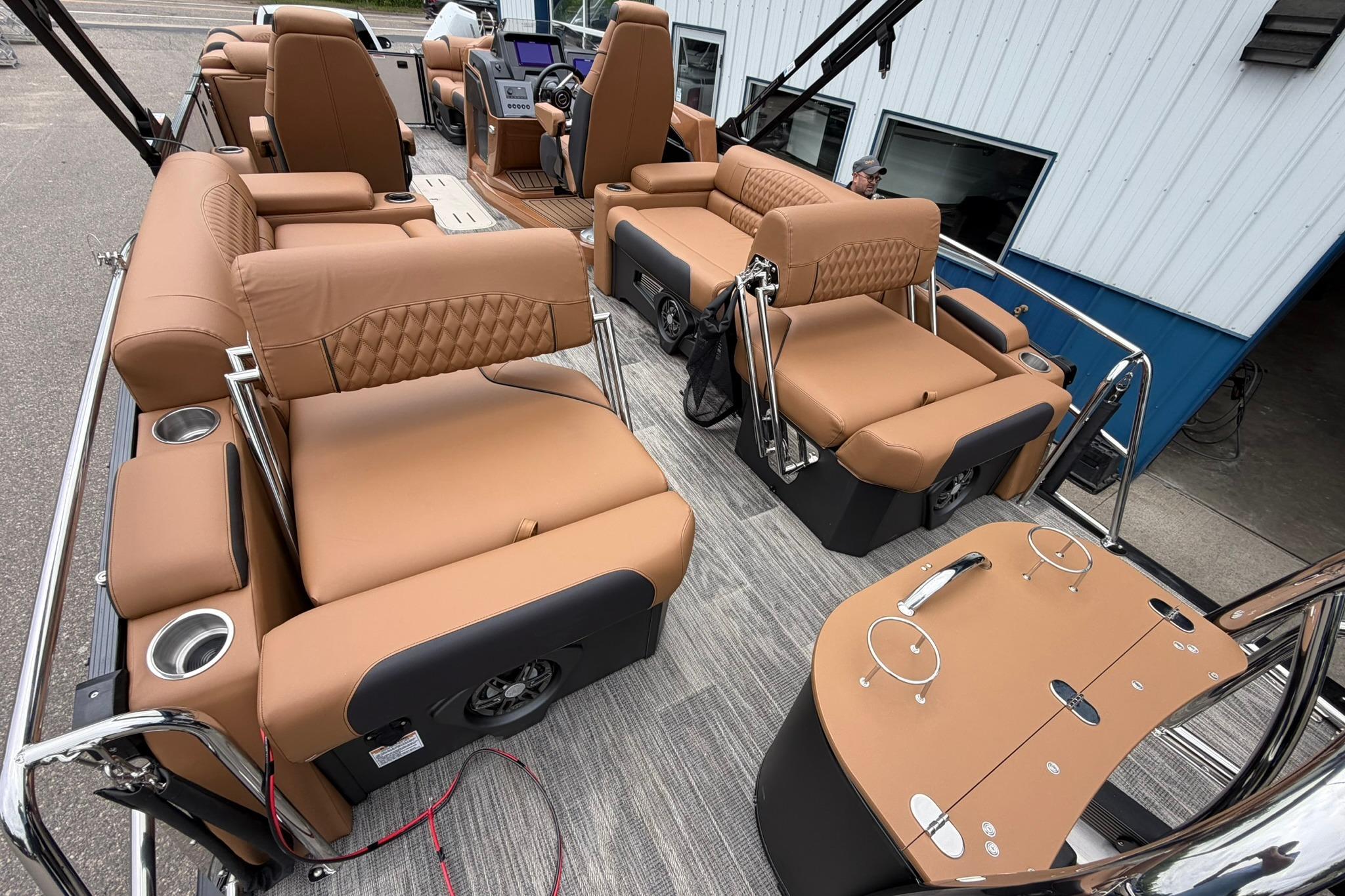 Luxurious interior of 2026 Avalon Catalina Quad Lounge Shift pontoon boat with tan seating.