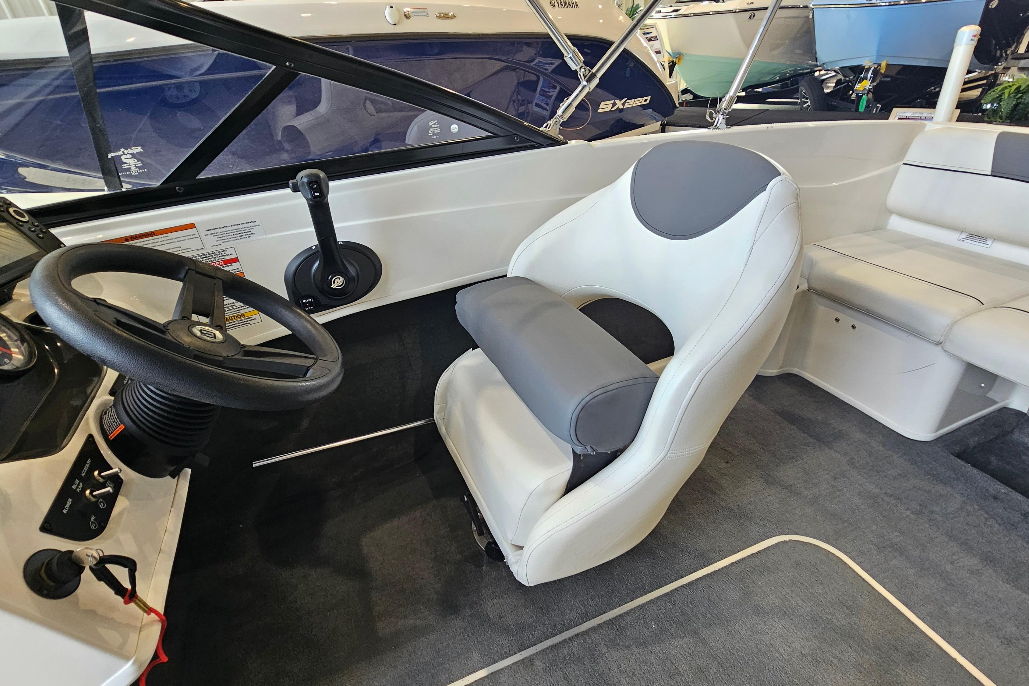 2019 Bayliner 170 Bowrider interior with steering wheel and seating.