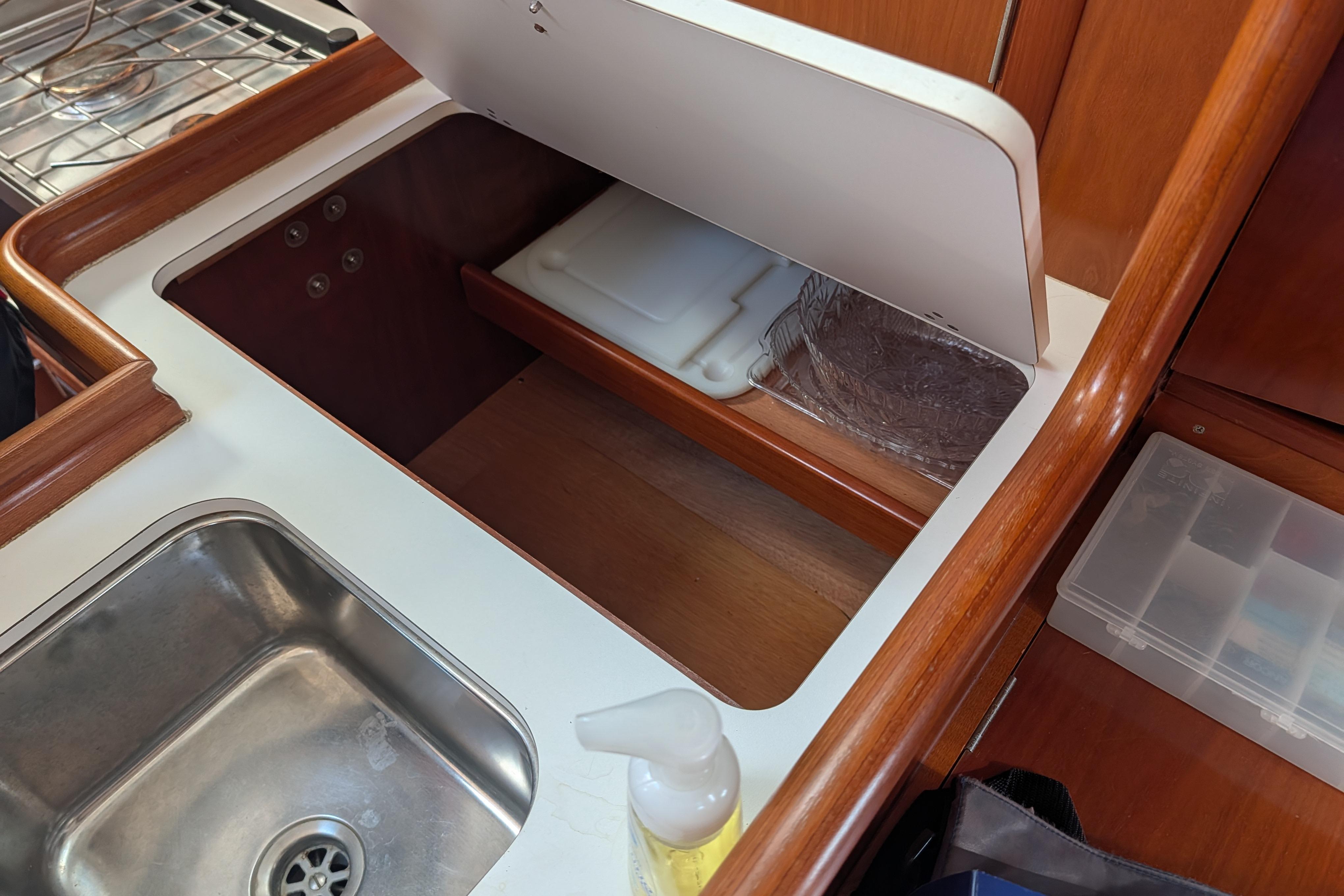 Galley area of 2001 Beneteau Oceanis 331 sailboat with sink and storage.