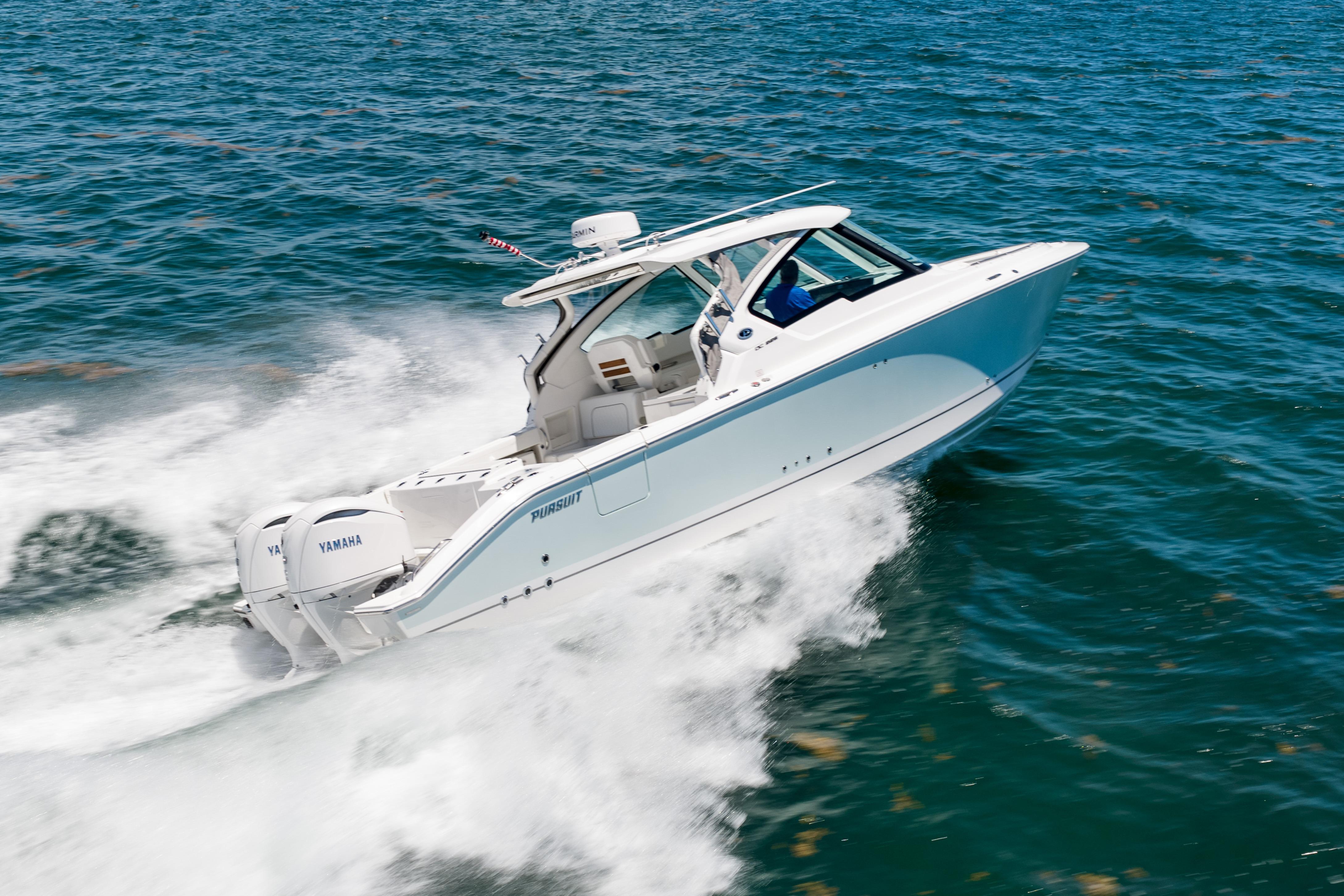 2026 Pursuit DC 326 Dual Console boat cruising on open water.