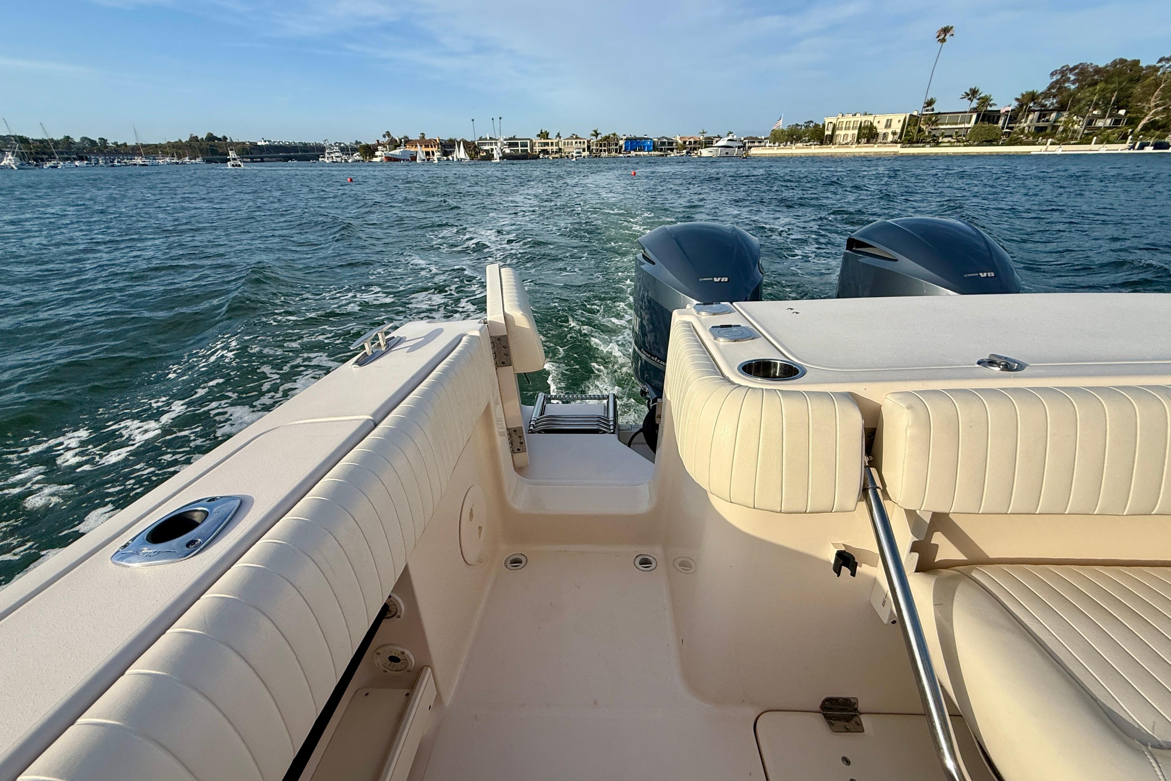 2012 Grady-White Canyon 336 boat interior with twin engines on open water.
