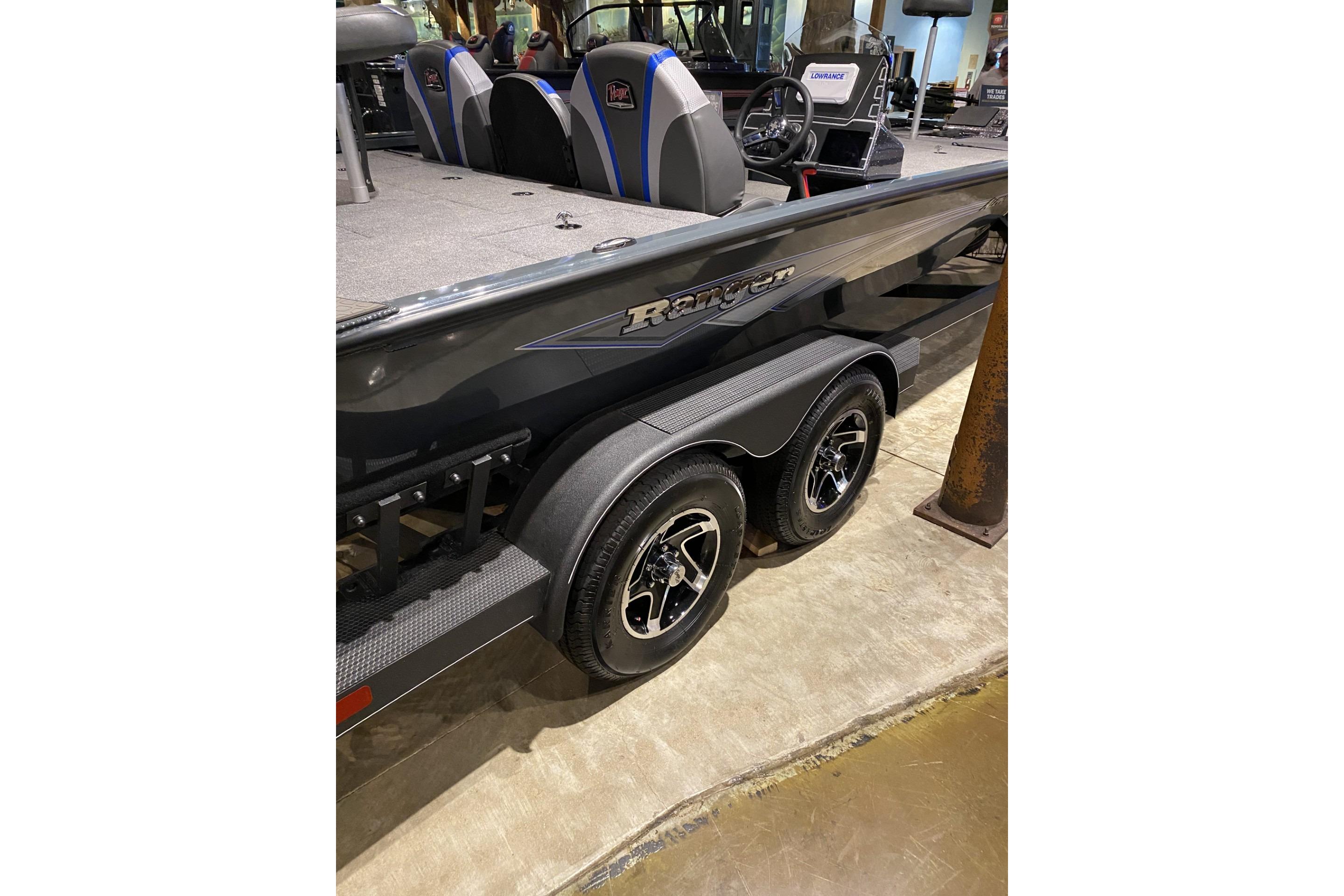 2025 Ranger ALPHA 208 boat with dual-axle trailer, sleek design, and modern interior.