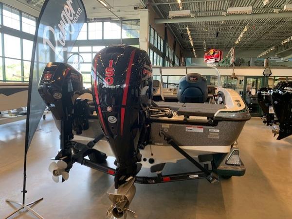 2024 Ranger 1850MS boat with dual 150 horsepower engines in showroom.