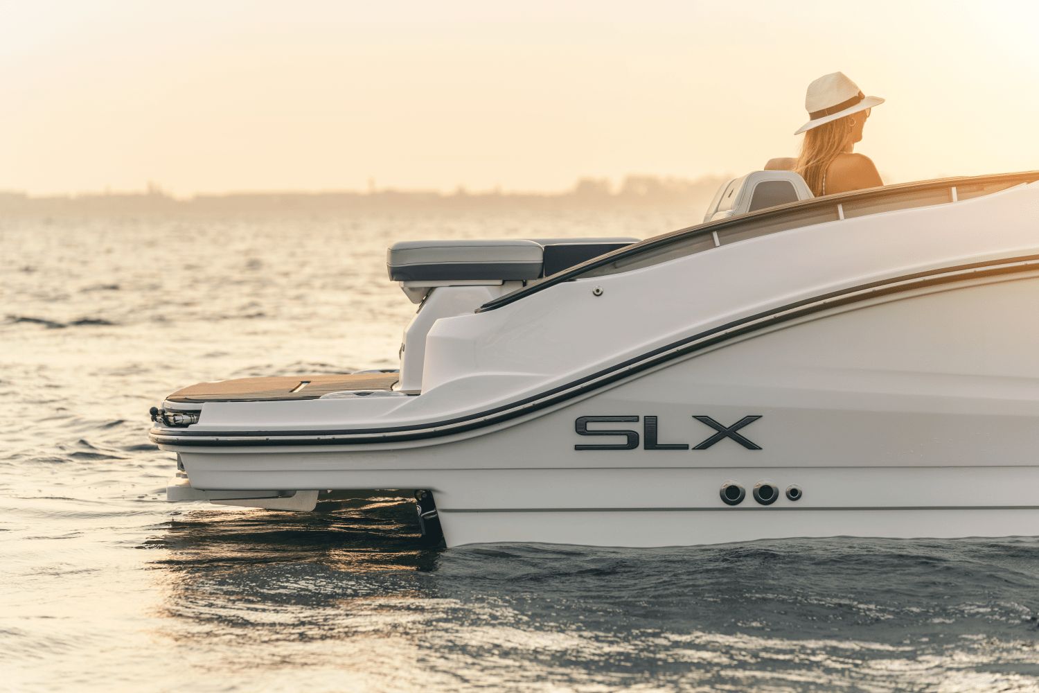 Sea Ray SLX 280 boat on water at sunset, 2025 model.