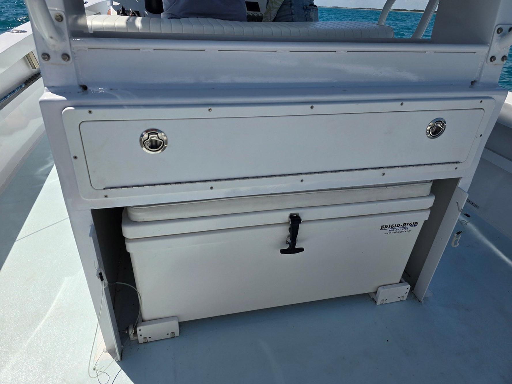 2012 Contender Custom 33 Center Console with storage compartment and cooler on deck.