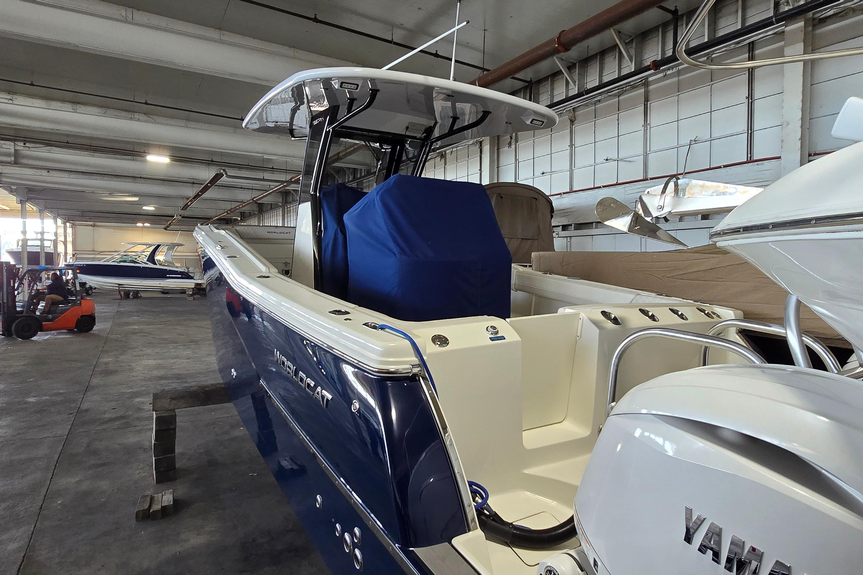 2024 WorldCat 280 CC-X boat in storage, featuring sleek design and Yamaha engine.
