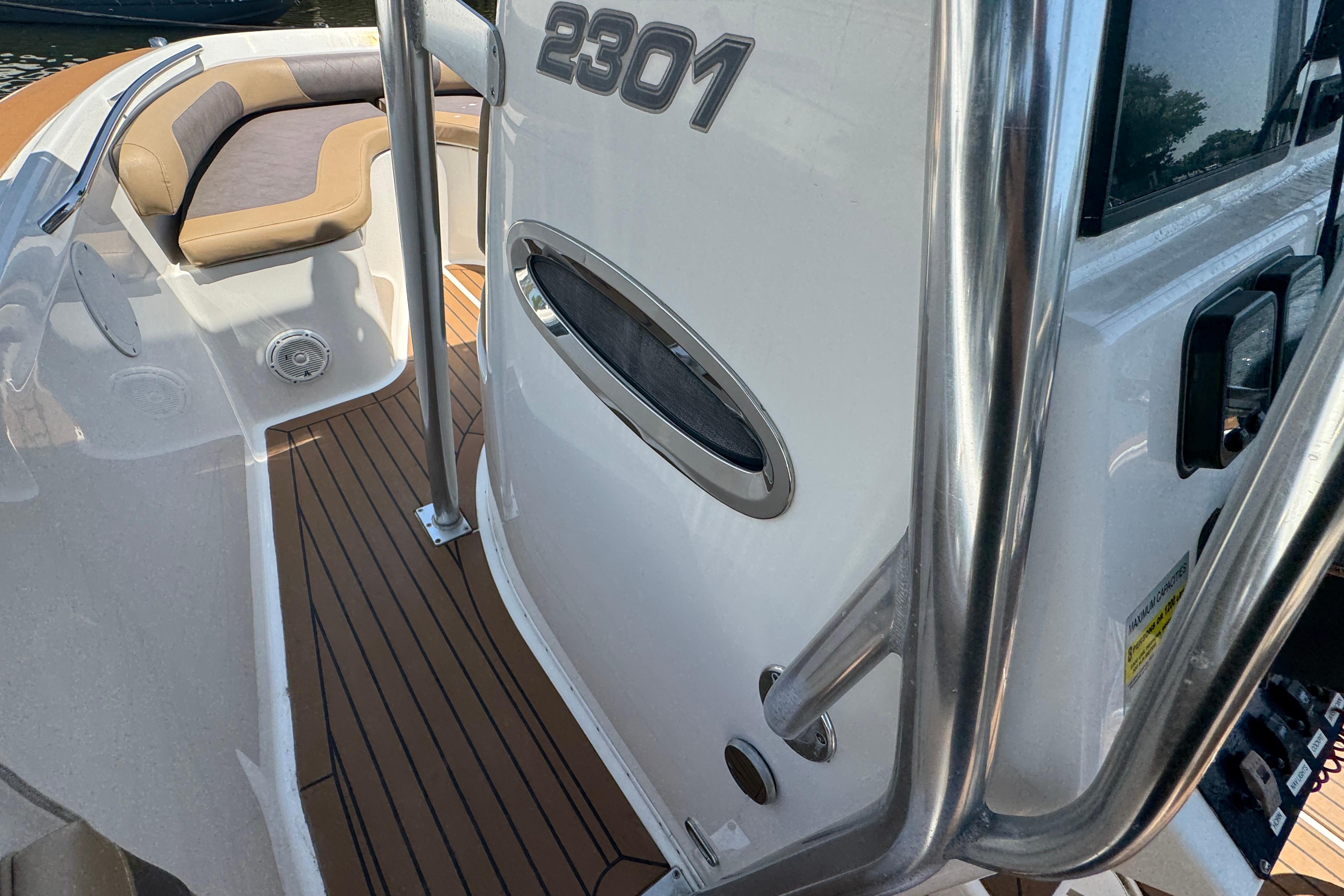 2014 Century 2301 Center Console boat interior with seating and stainless steel details.