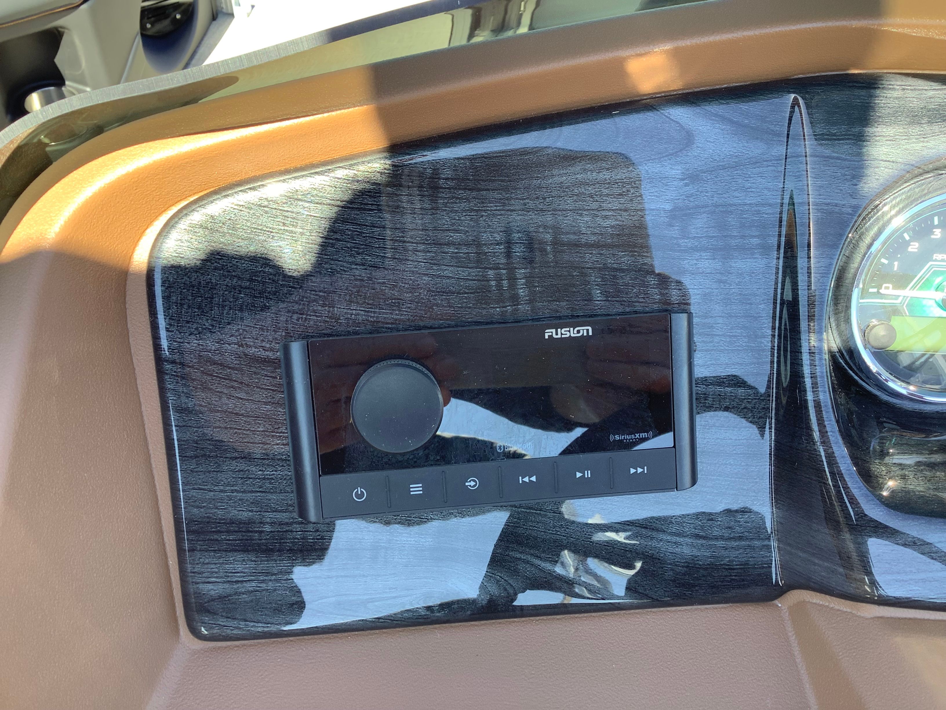 Dashboard of 2026 Tahoe 2385 LTZ Quad Lounger Shift with Fusion stereo system.
