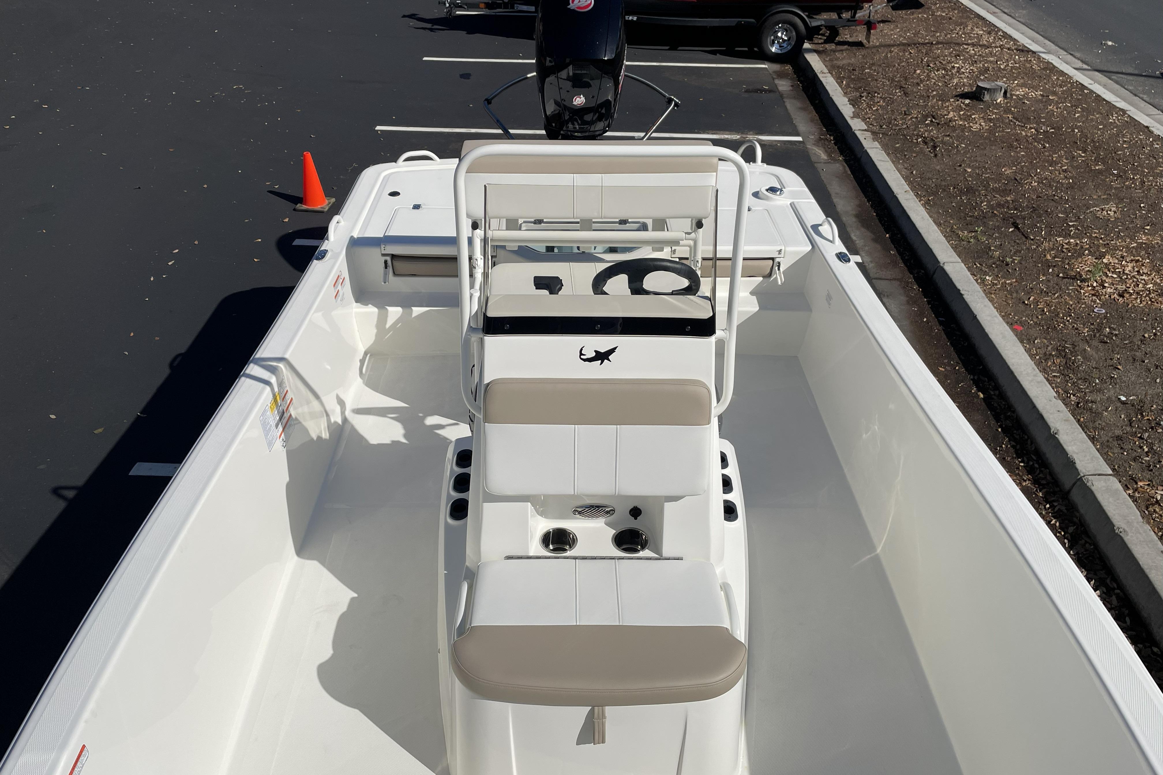 2026 Mako Pro Skiff 19 CC boat interior with steering console and seating.