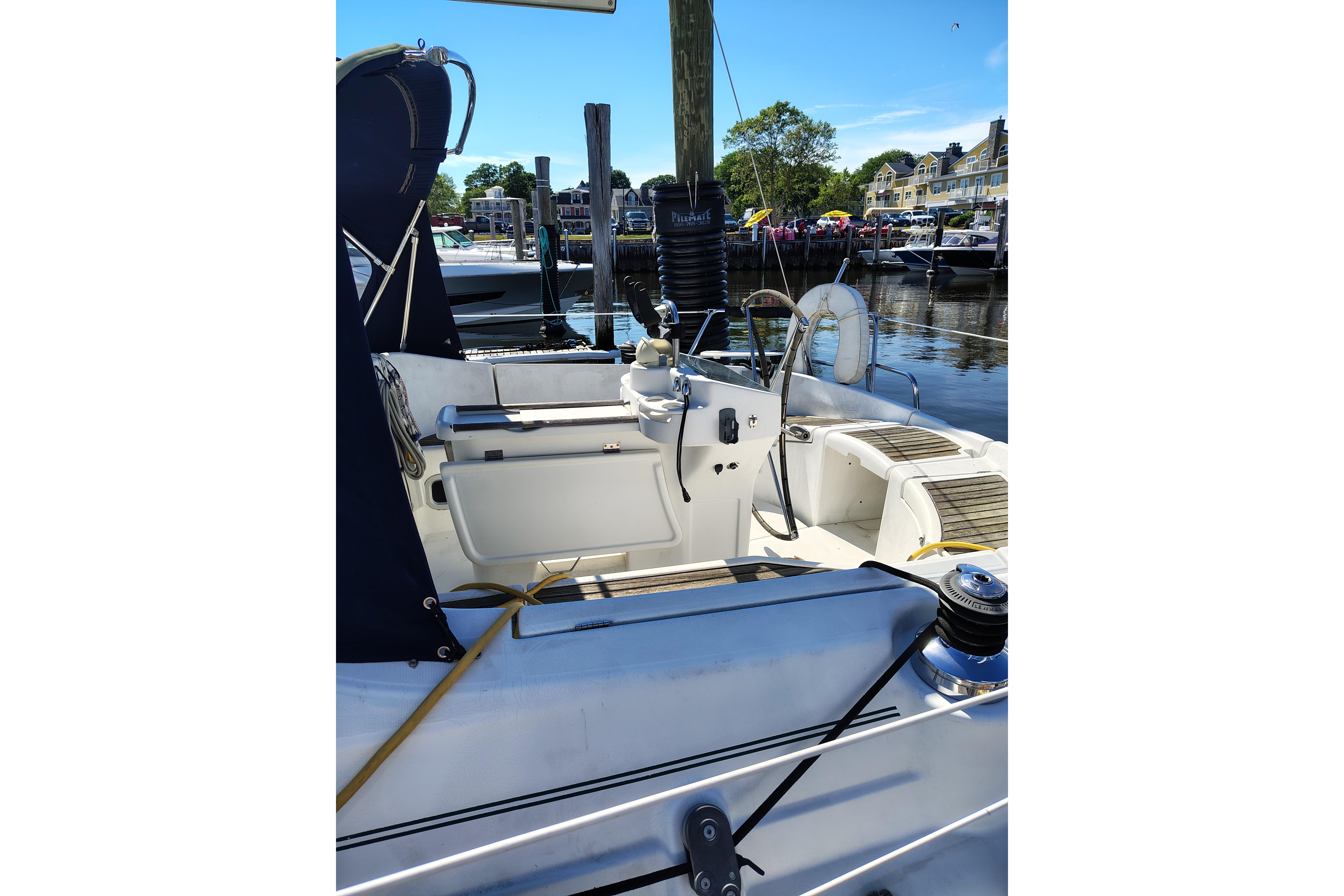 Cockpit of a 2001 Beneteau Oceanis 411 sailboat docked at a marina.
