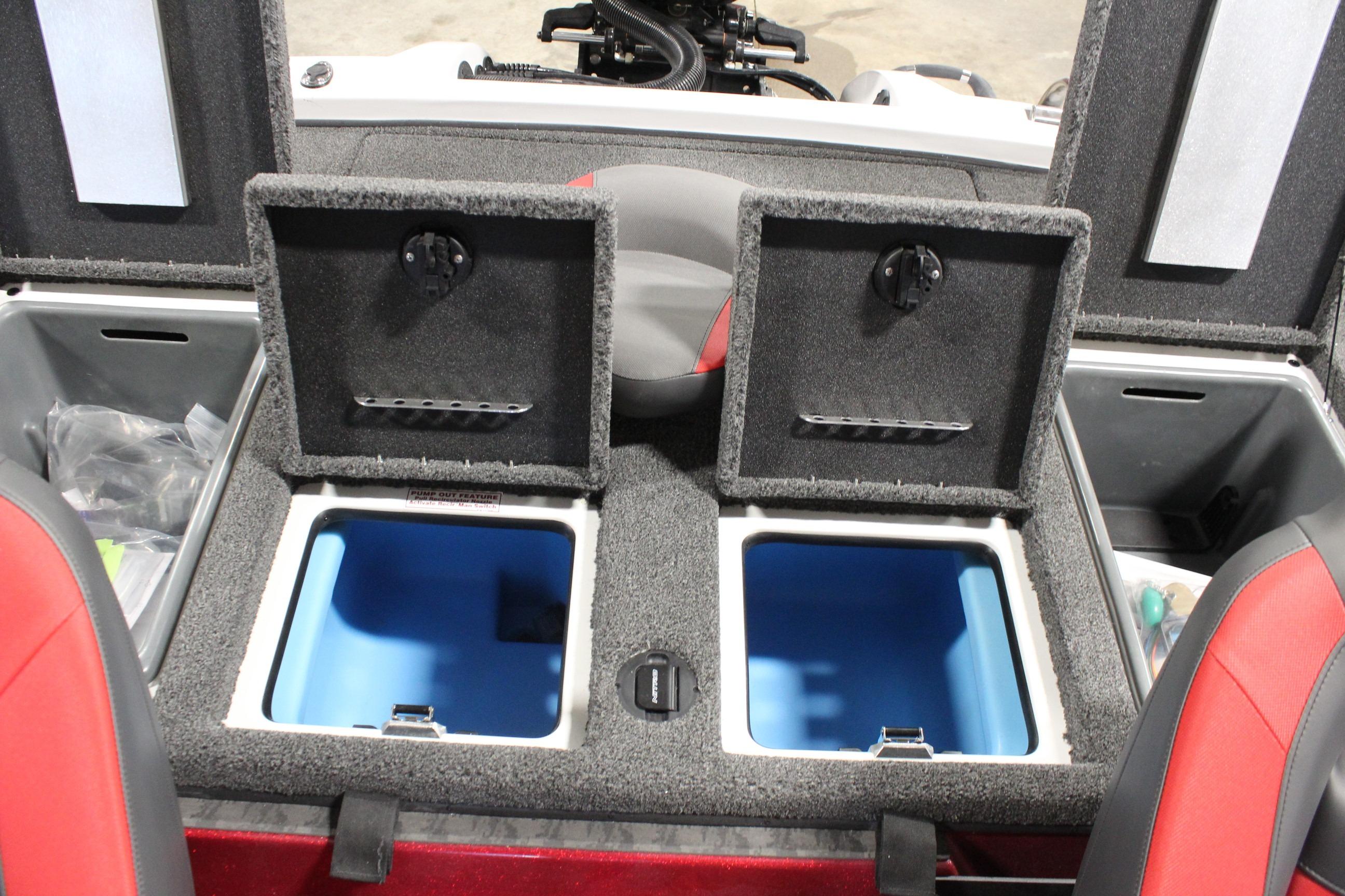 2026 Nitro Z19 XL Pro boat storage compartments with open lids and red seats.