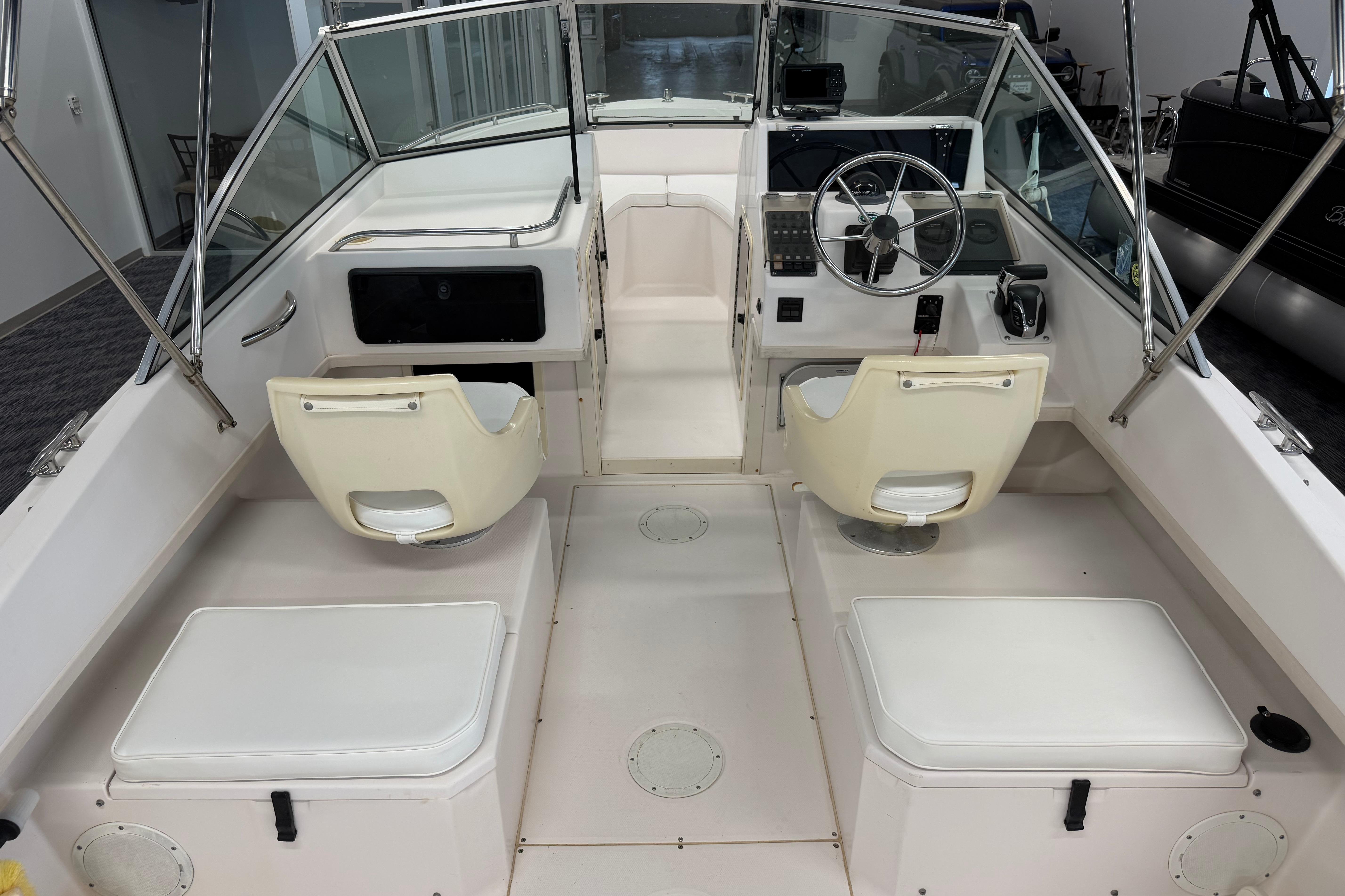 2001 Grady-White Tournament 223 boat interior with dual seats and steering console.