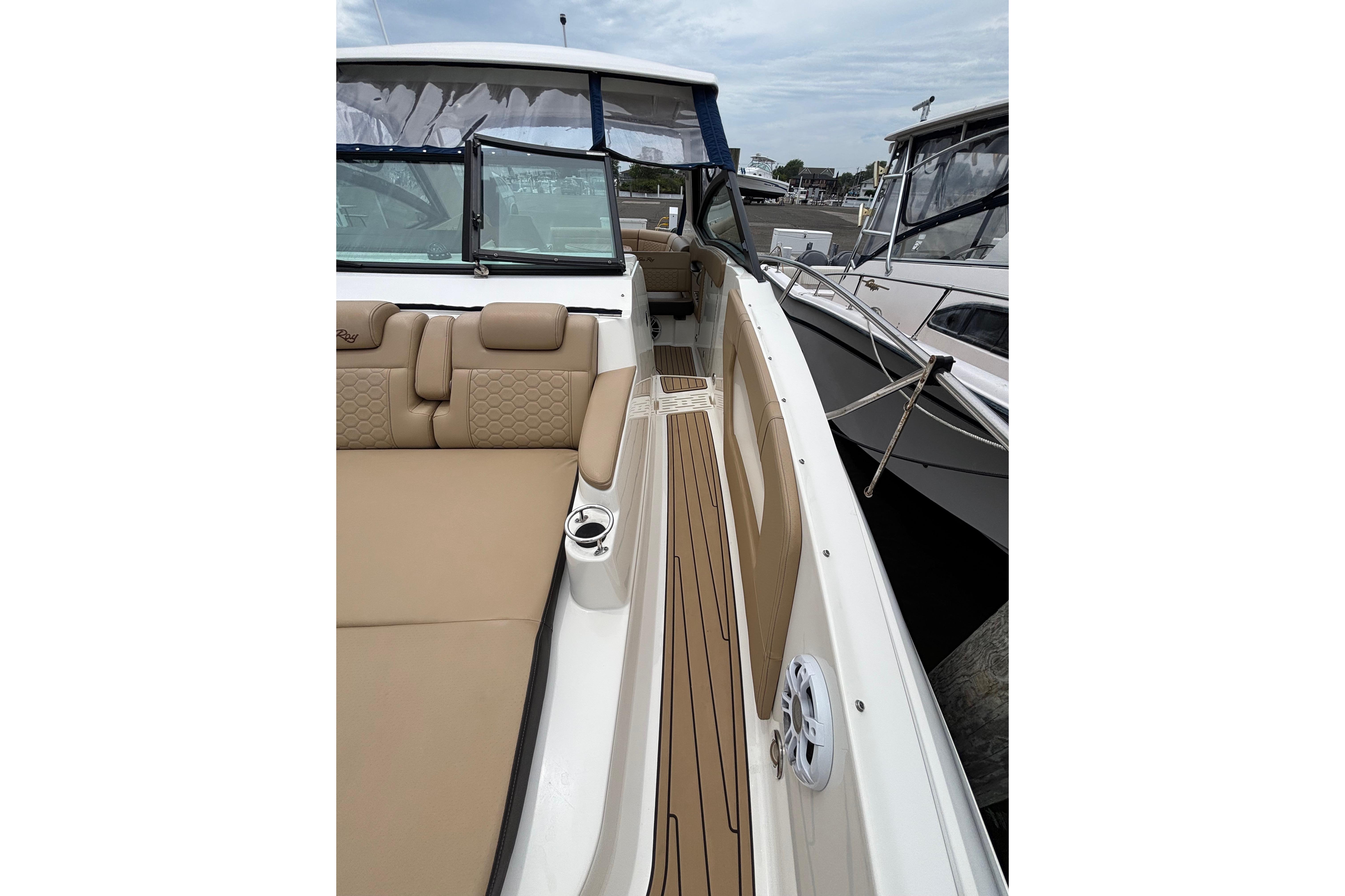 2021 Sea Ray Sundancer 320 Outboard with tan seating and sleek deck design.