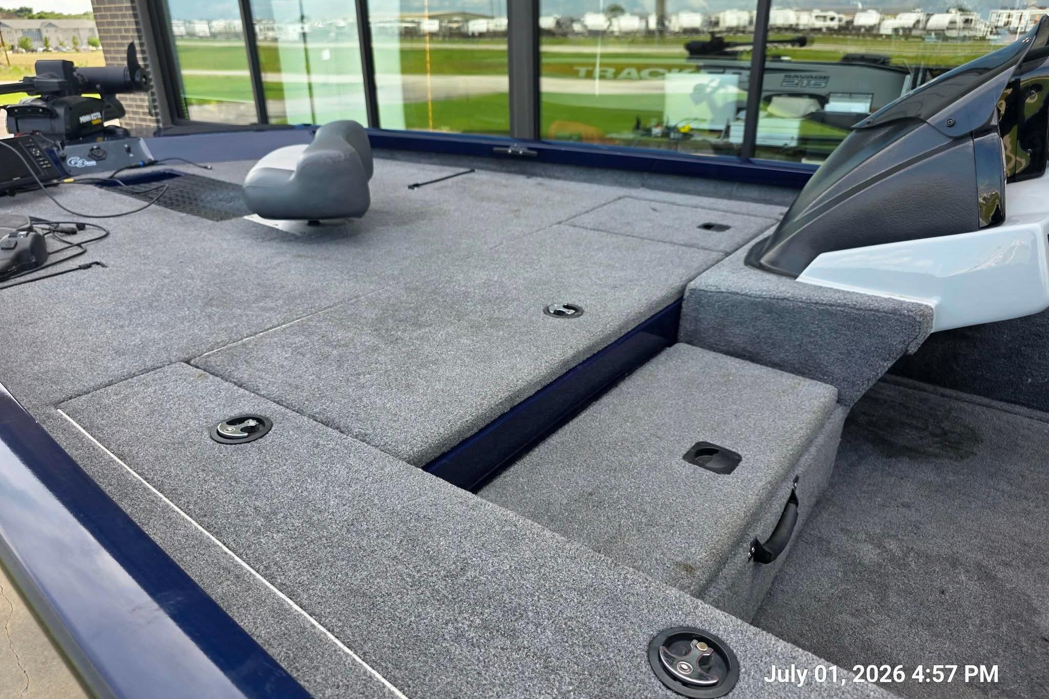 2017 G3 Sportsman 18 boat interior with gray carpet and seating.