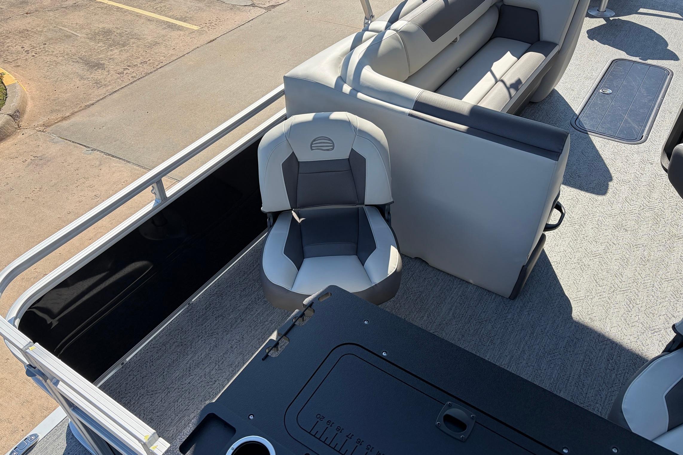 2026 Sun Tracker Fishin' Barge 22 XP3 interior with seating and deck view.