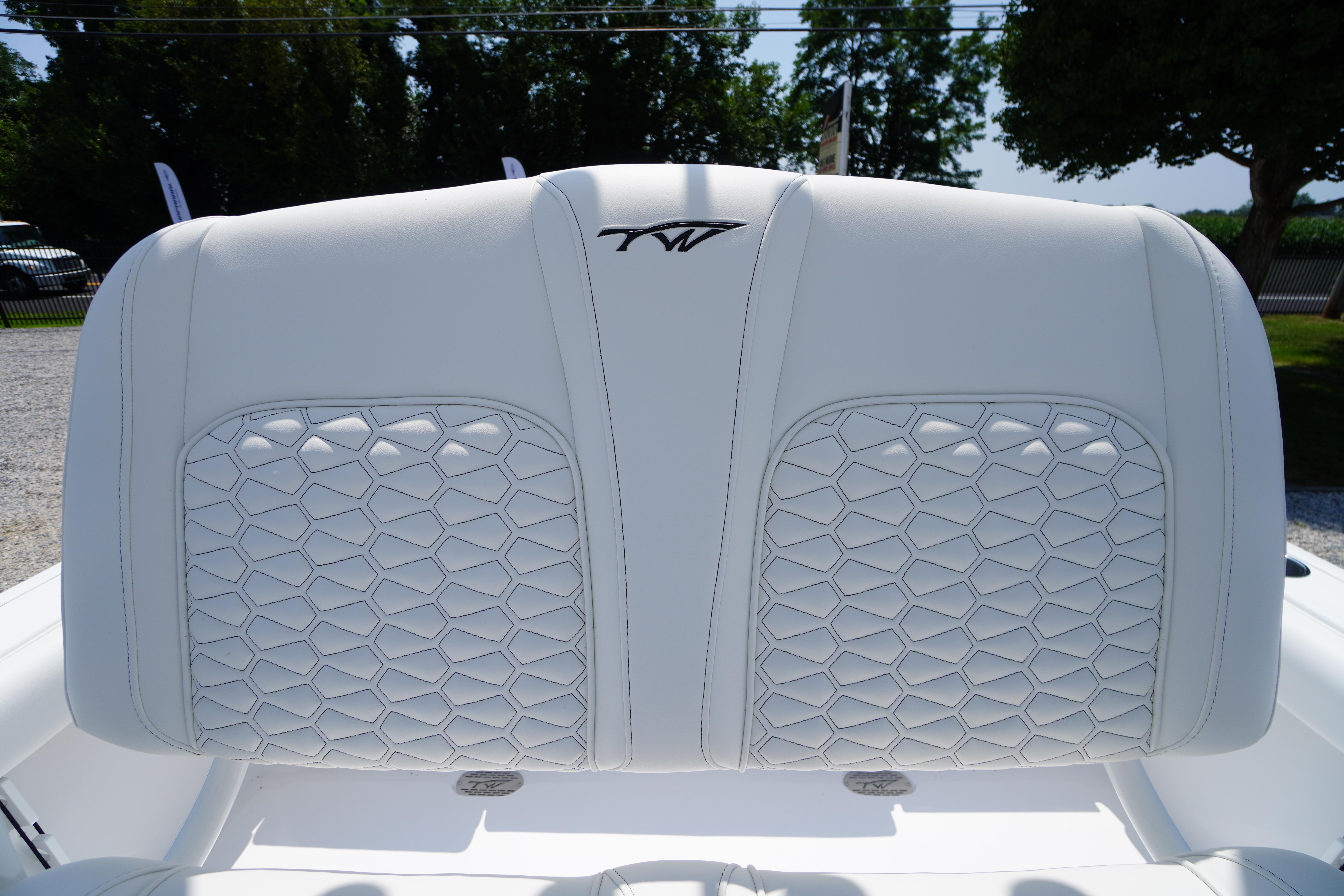 2026 Tidewater 232 LXF boat seat with elegant white upholstery and hexagonal stitching.
