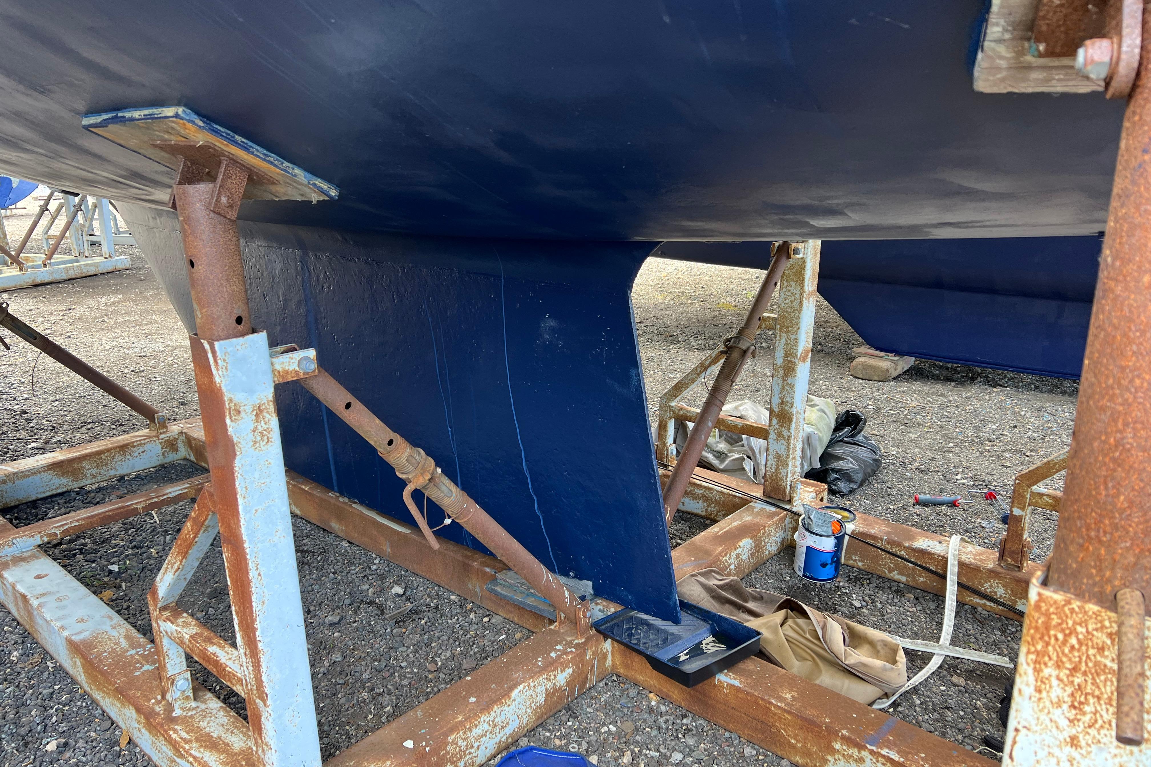 Bottom view of 1983 Westerly Sealord 39 sailboat on rusty stands.