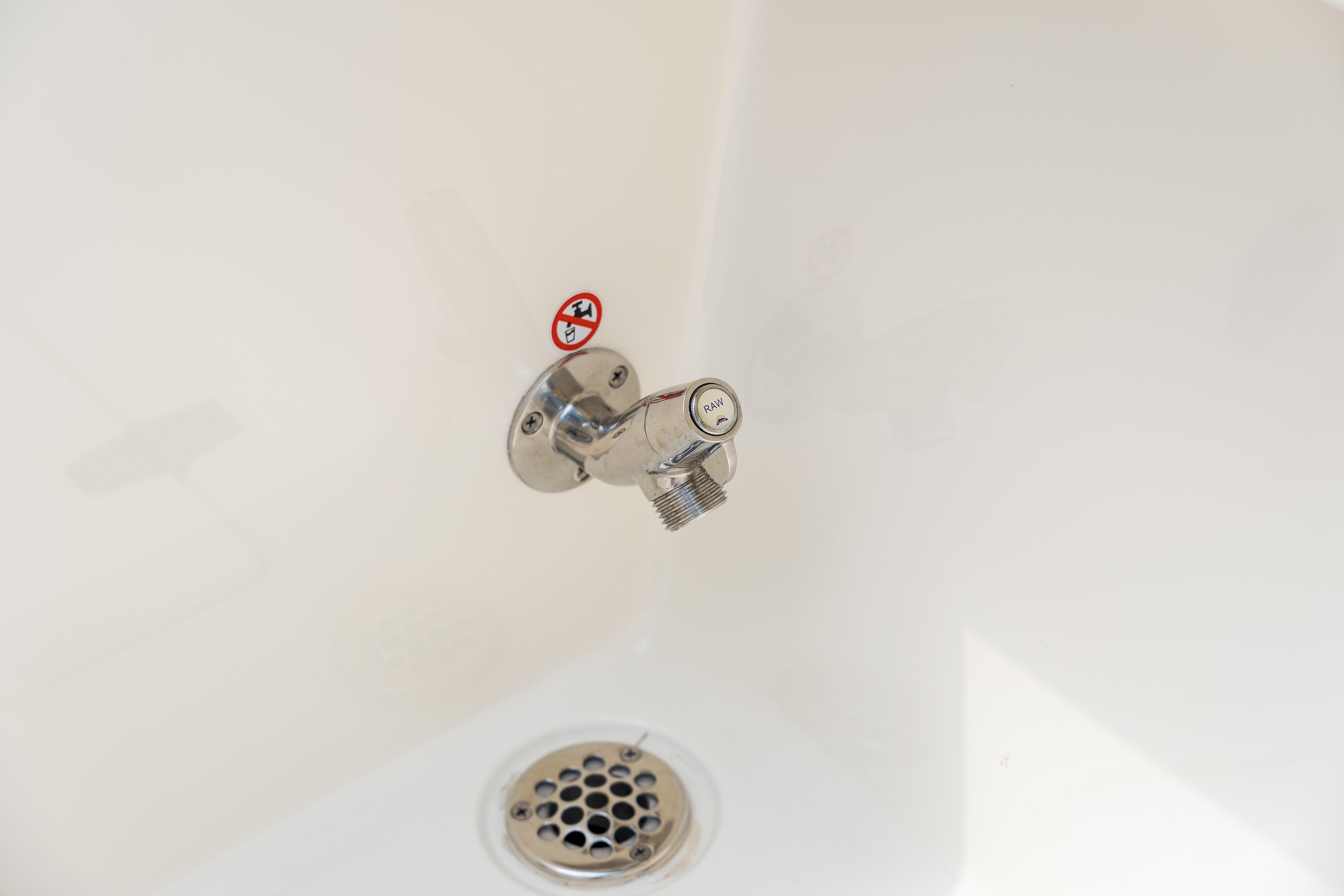 Boat drain and raw water outlet on 2023 Cobia 240 Dual Console.