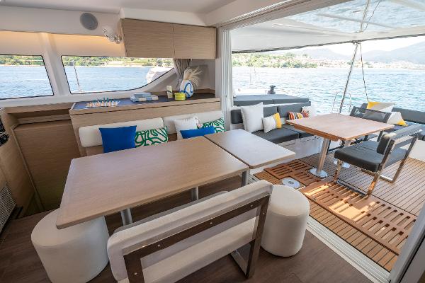 Luxurious interior of 2025 Lagoon 43 yacht with modern seating and dining area.