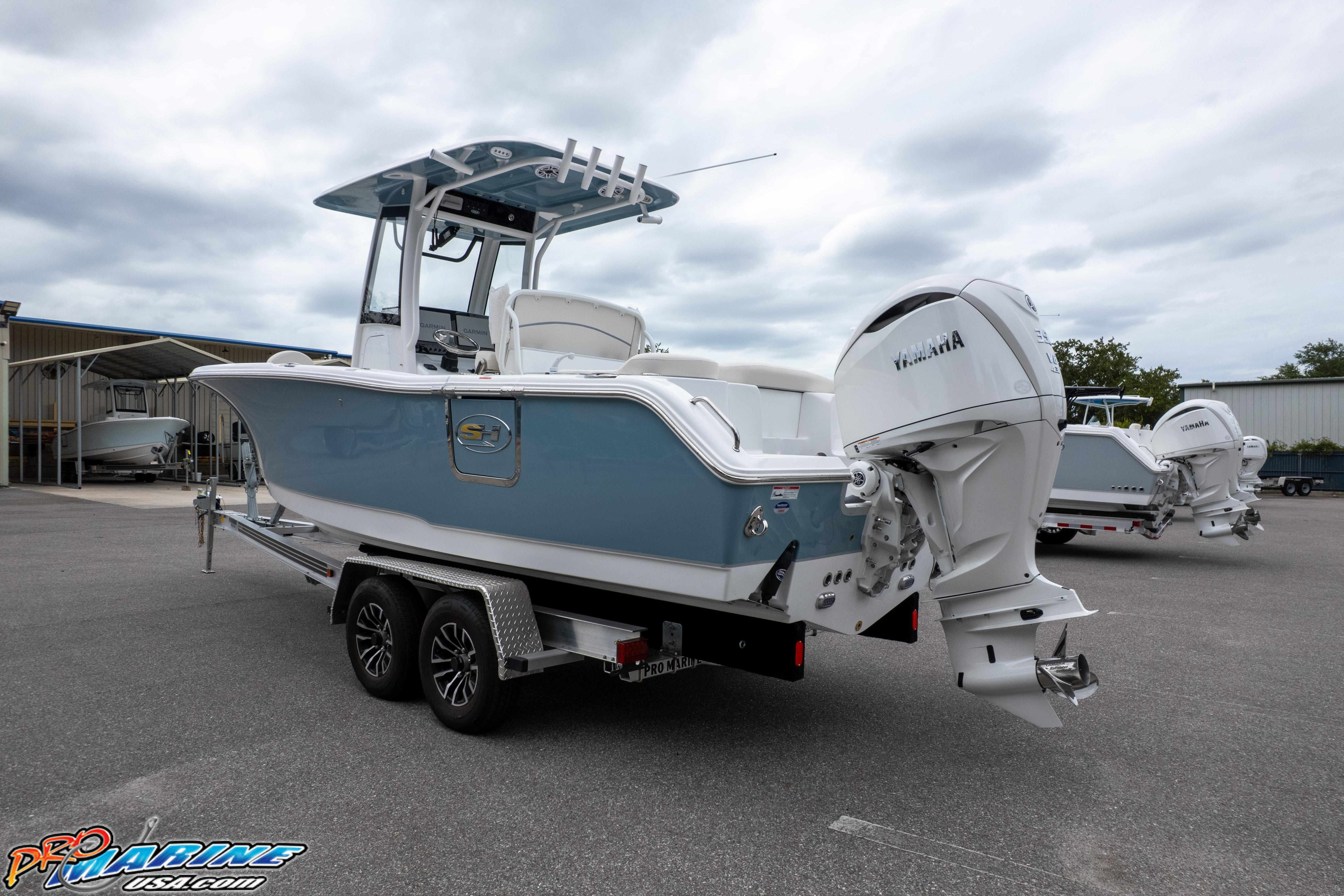 2027 Sea Hunt Ultra 255 SE boat on trailer, featuring Yamaha outboard motor.