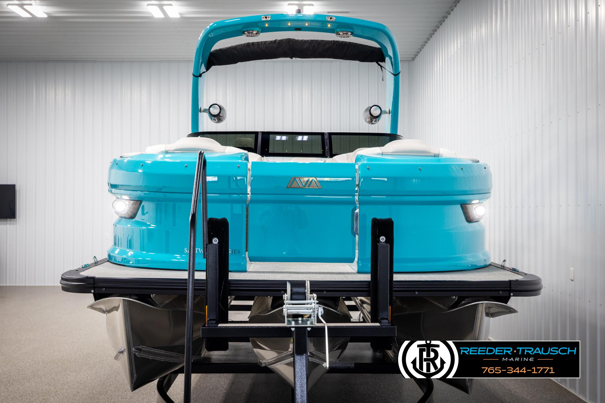 2025 Avalon 2585 Excal VRBW pontoon boat in showroom, vibrant blue exterior.