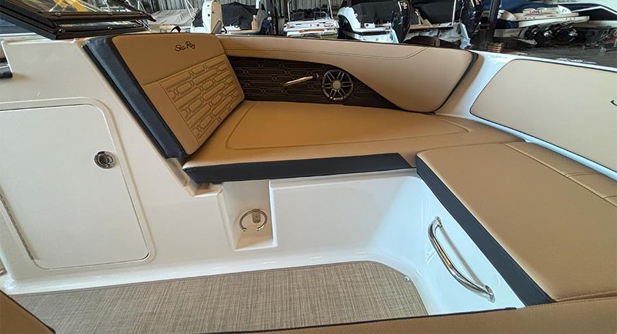 2025 Sea Ray SPX 190 Outboard interior with tan seating and modern design.