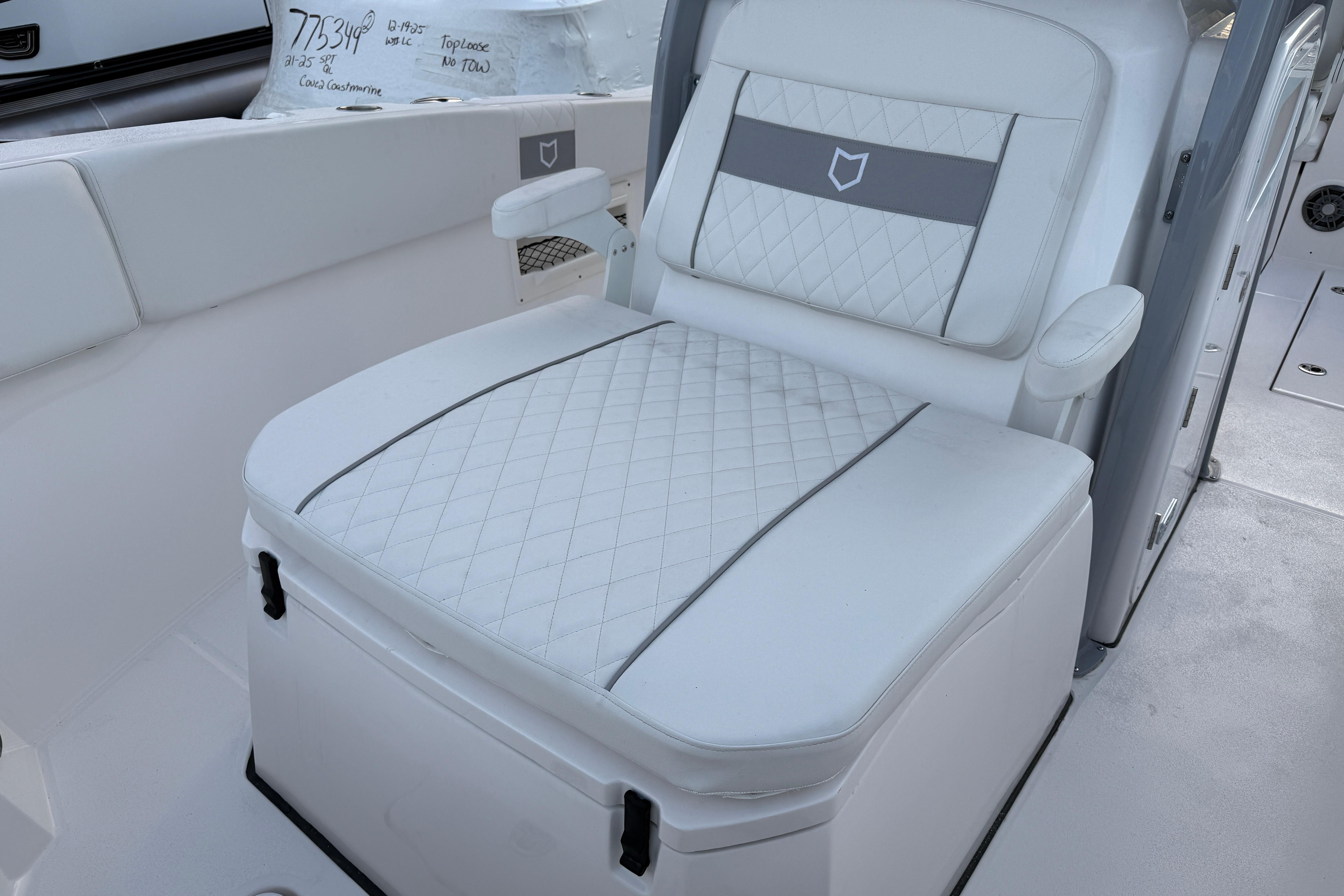 2026 Sea Fox 268 Commander boat seat with quilted white upholstery.