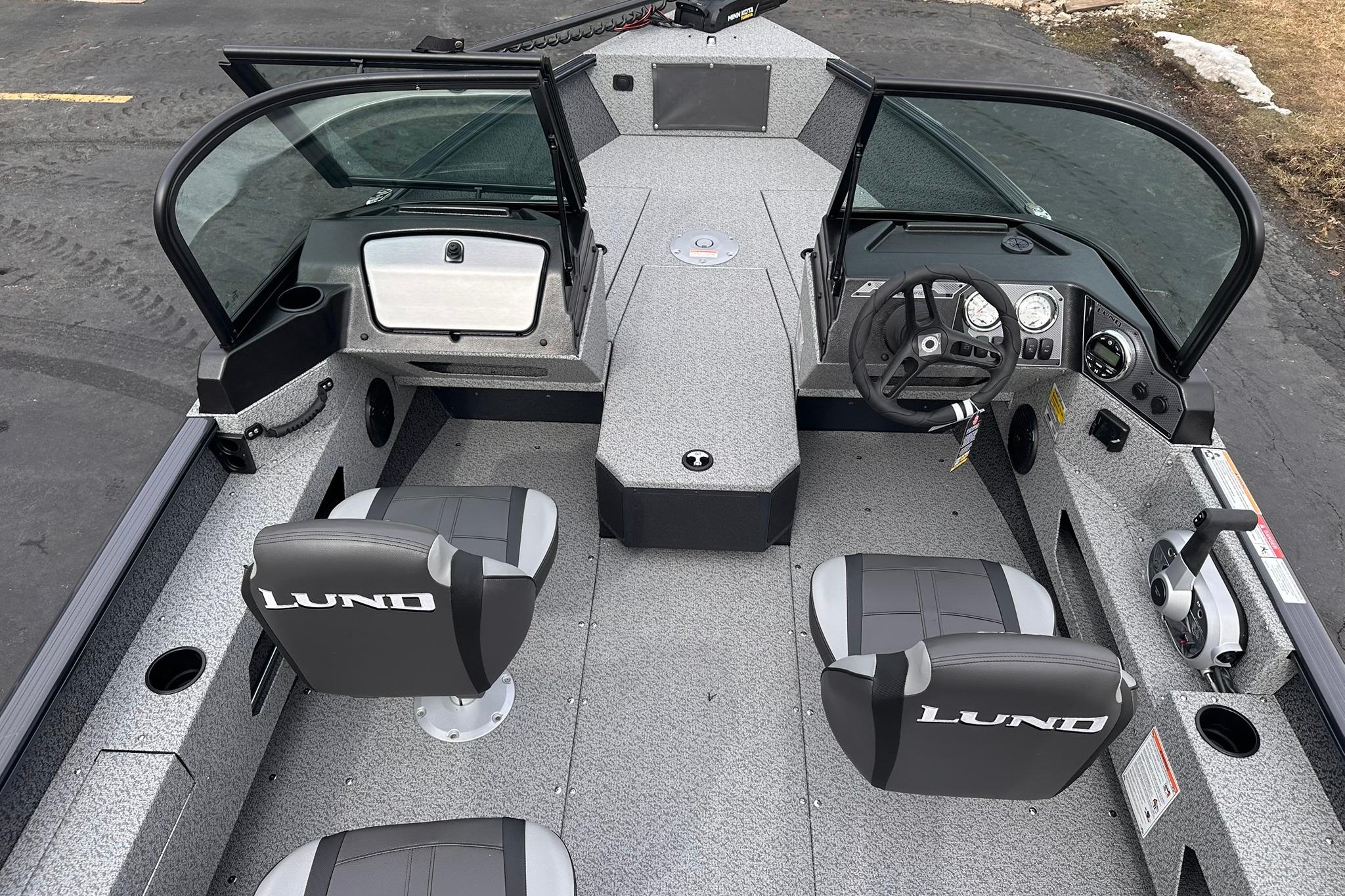 2026 Lund 1775 Adventure Sport boat interior with dual seats and steering console.