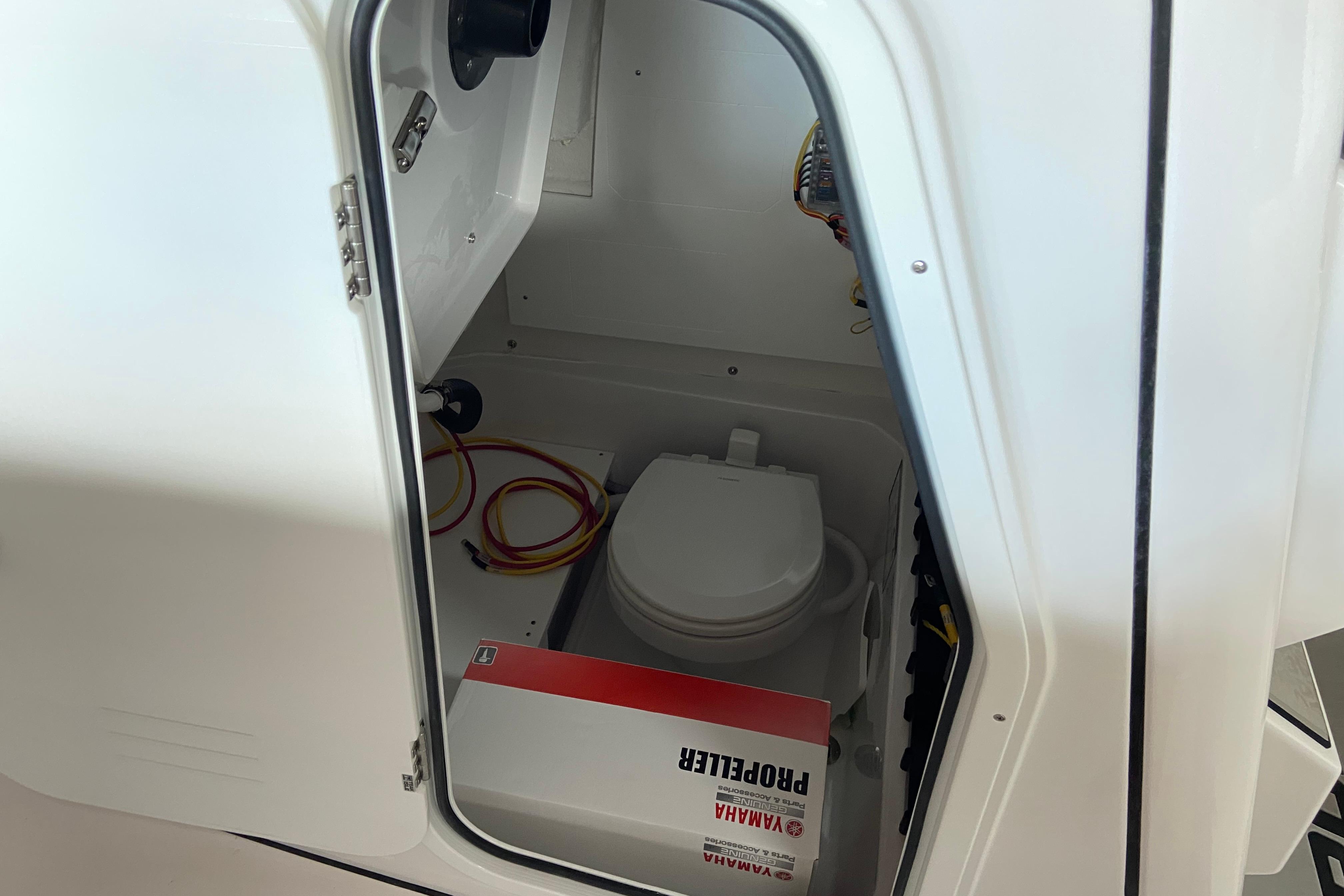 Interior view of 2026 Sportsman Open 232 Center Console boat compartment.
