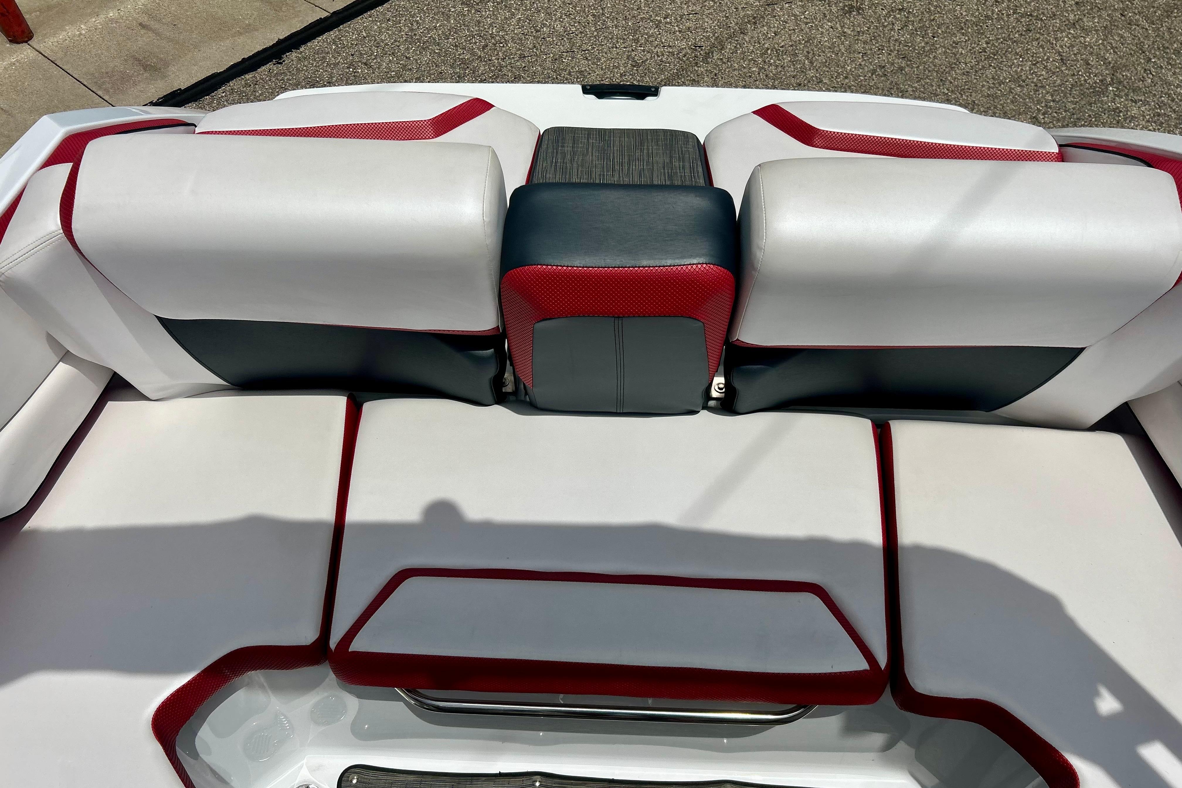 2021 Scarab 195 ID boat interior with red, white, and black seating design.