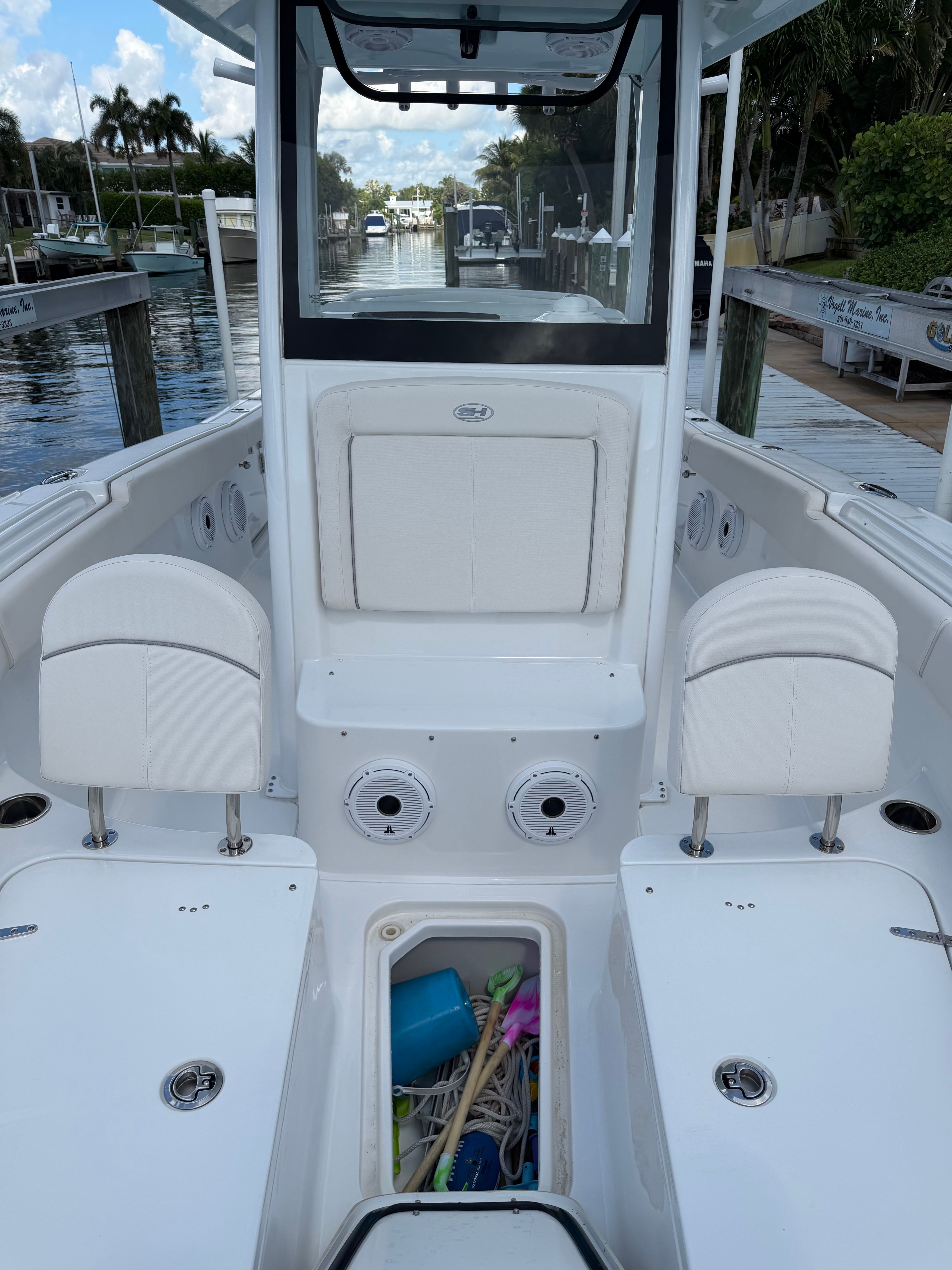 The image shows the cockpit of a 2024 Sea Hunt Ultra 265 SE boat.