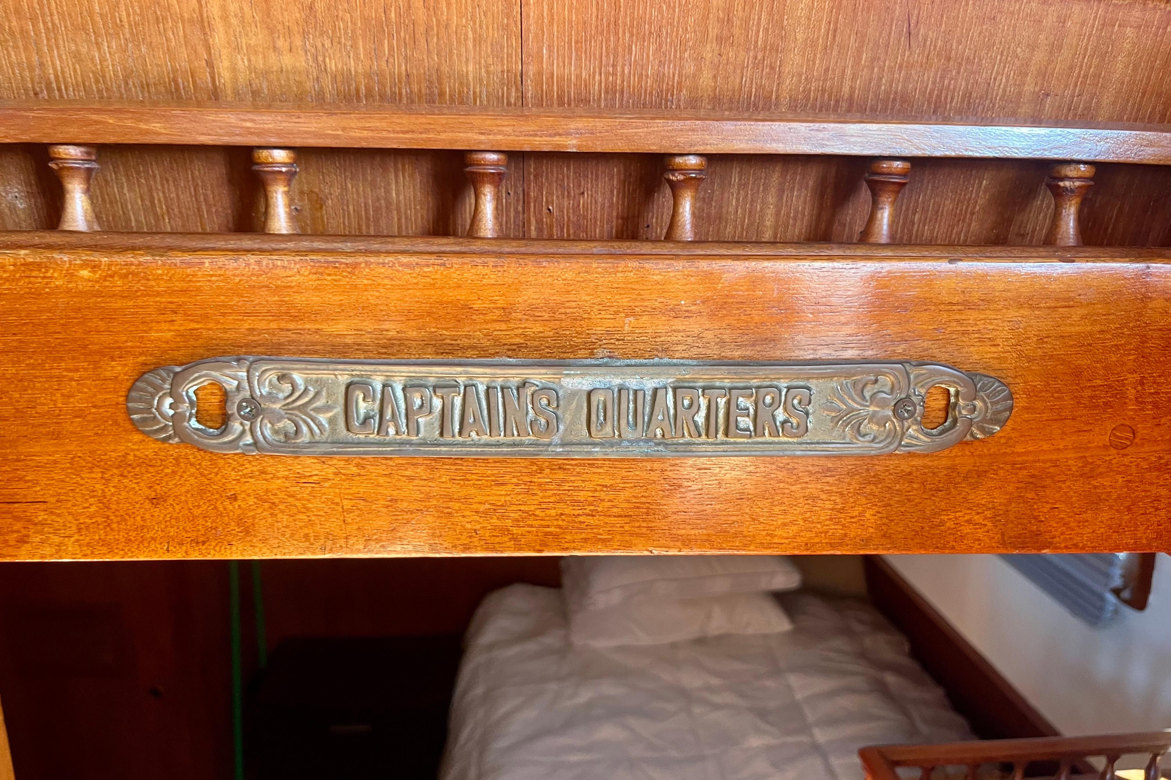 Wooden interior of 1978 C&L 37 boat with "Captain's Quarters" sign.