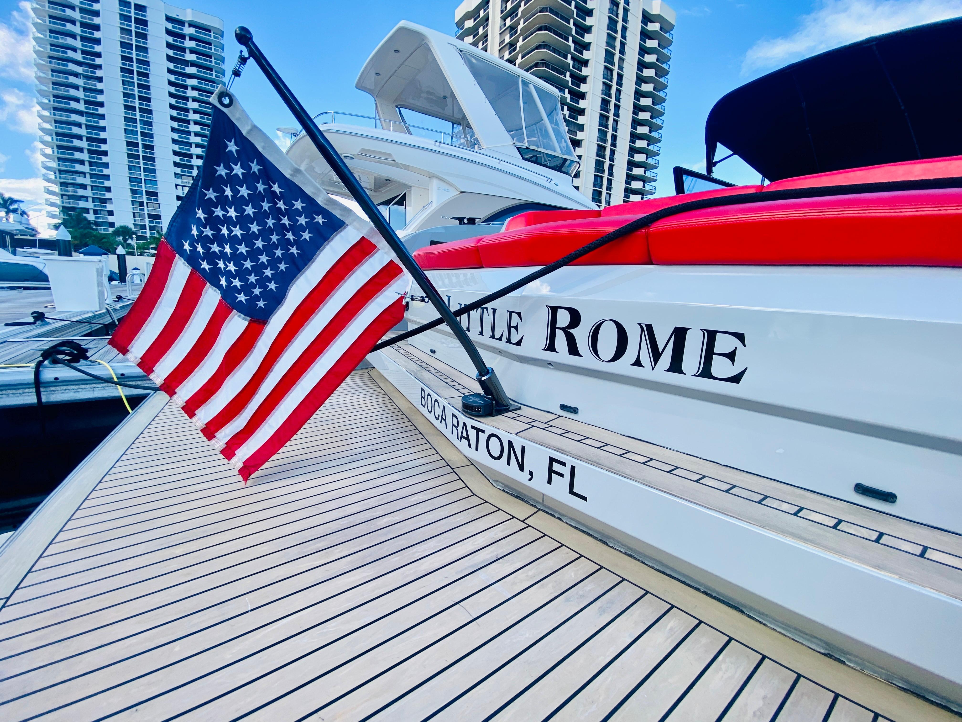 Vanquish VQ45 yacht docked, displaying American flag, Boca Raton, FL, 2020 model.