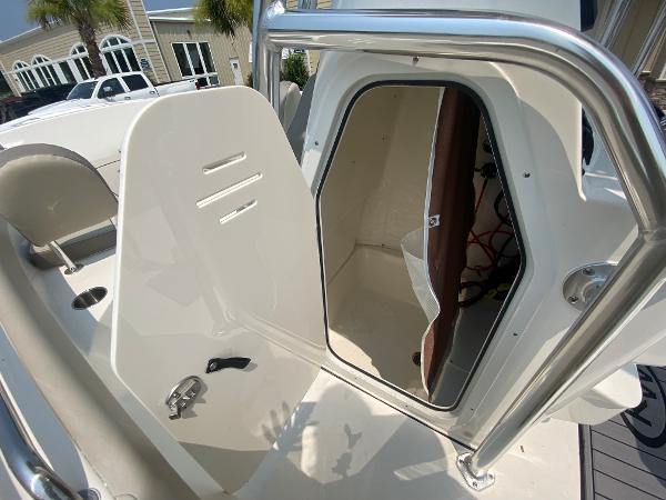 2024 Key West 203 FS boat interior with open storage compartment.